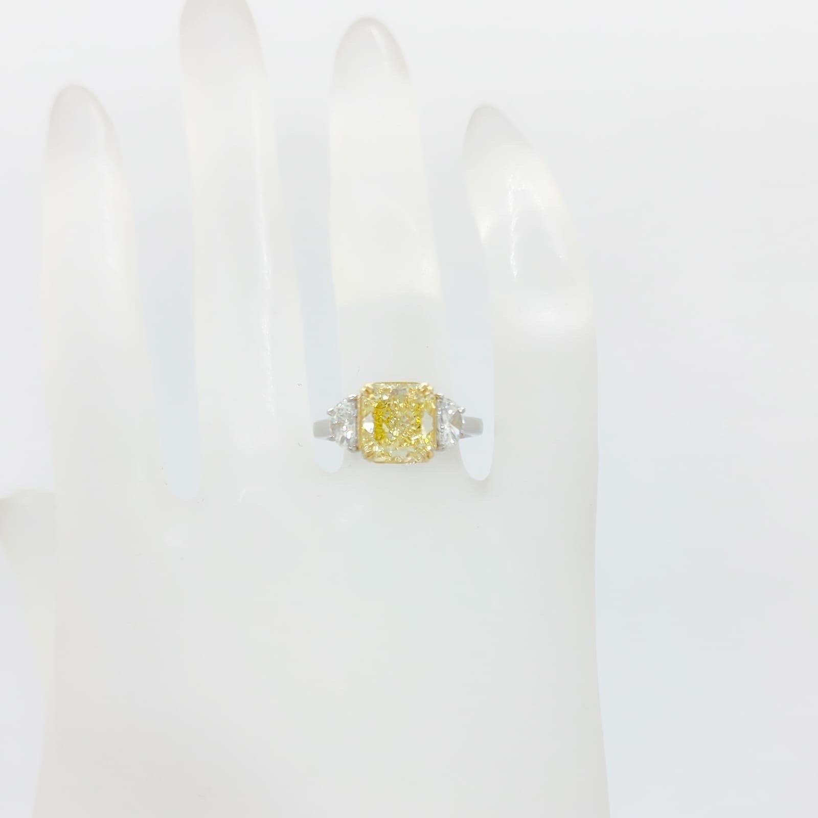 GIA Fancy Intense Yellow Diamond Radiant Three Stone Ring in Platinum and 18k For Sale 2