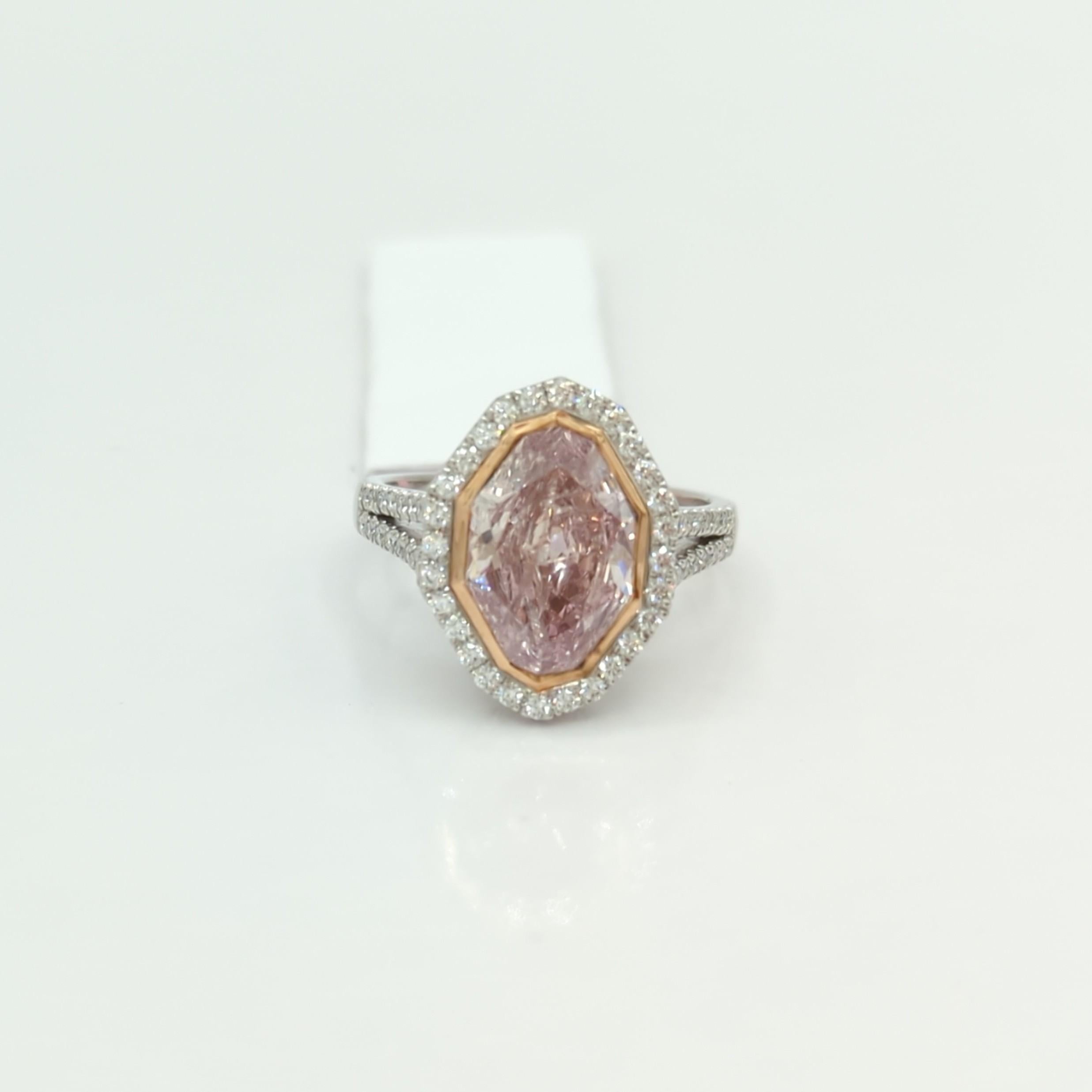 Absolutely stunning GIA 3.06 ct. fancy pink diamond marquise with 0.50 ct. good quality white diamond rounds.  Handmade in platinum and 18k rose gold.  Ring size 8+.  GIA certificate included.