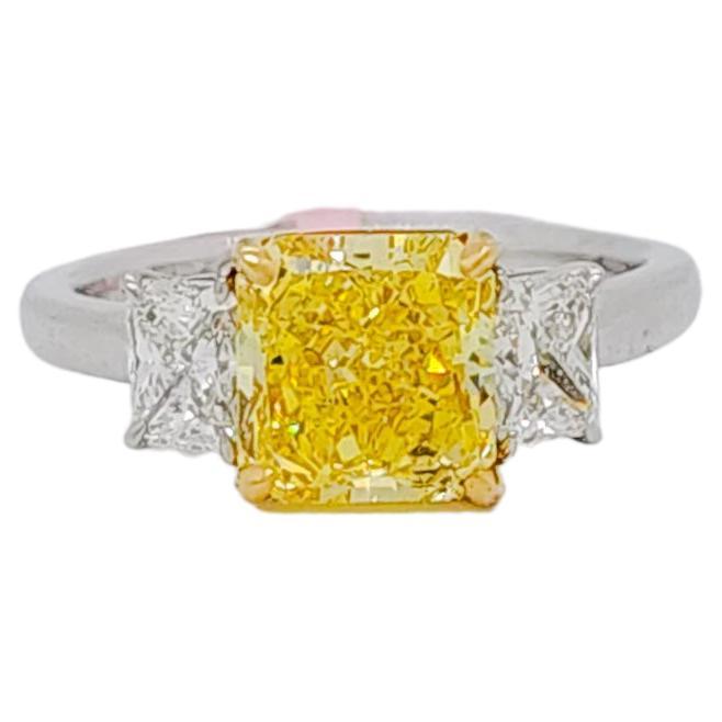 GIA Fancy Vivid Yellow Radiant and White Diamond Three Stone Ring in 18k 