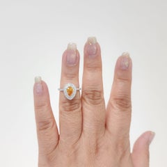 GIA Fancy Vivid Yellowish Orange Pear and White Diamond Ring in Platinum