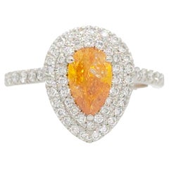 GIA Fancy Vivid Yellowish Orange Pear and White Diamond Ring in Platinum