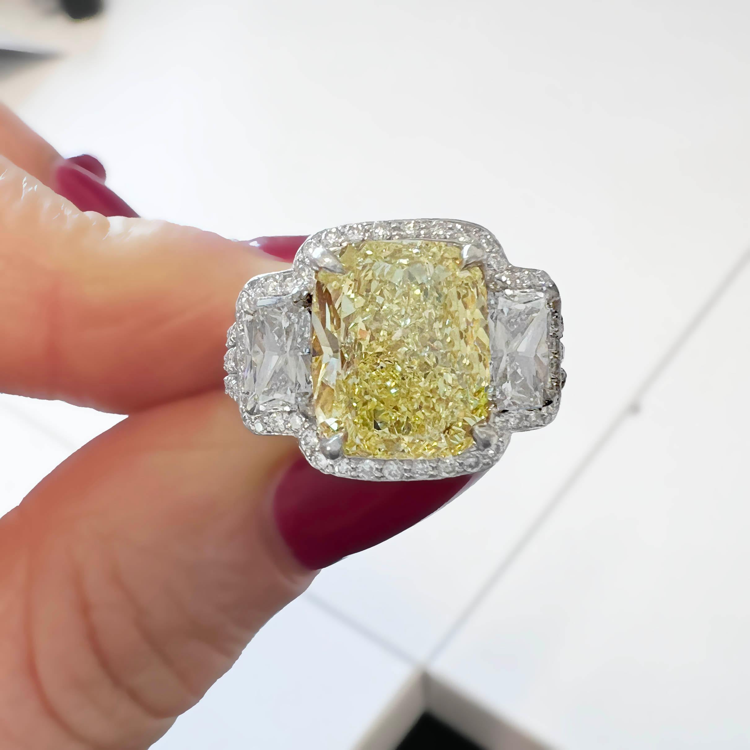 Contemporary GIA Fancy Yellow 4.04 Carat Cushion-Cut Diamond 3-Stone Engagement Ring For Sale