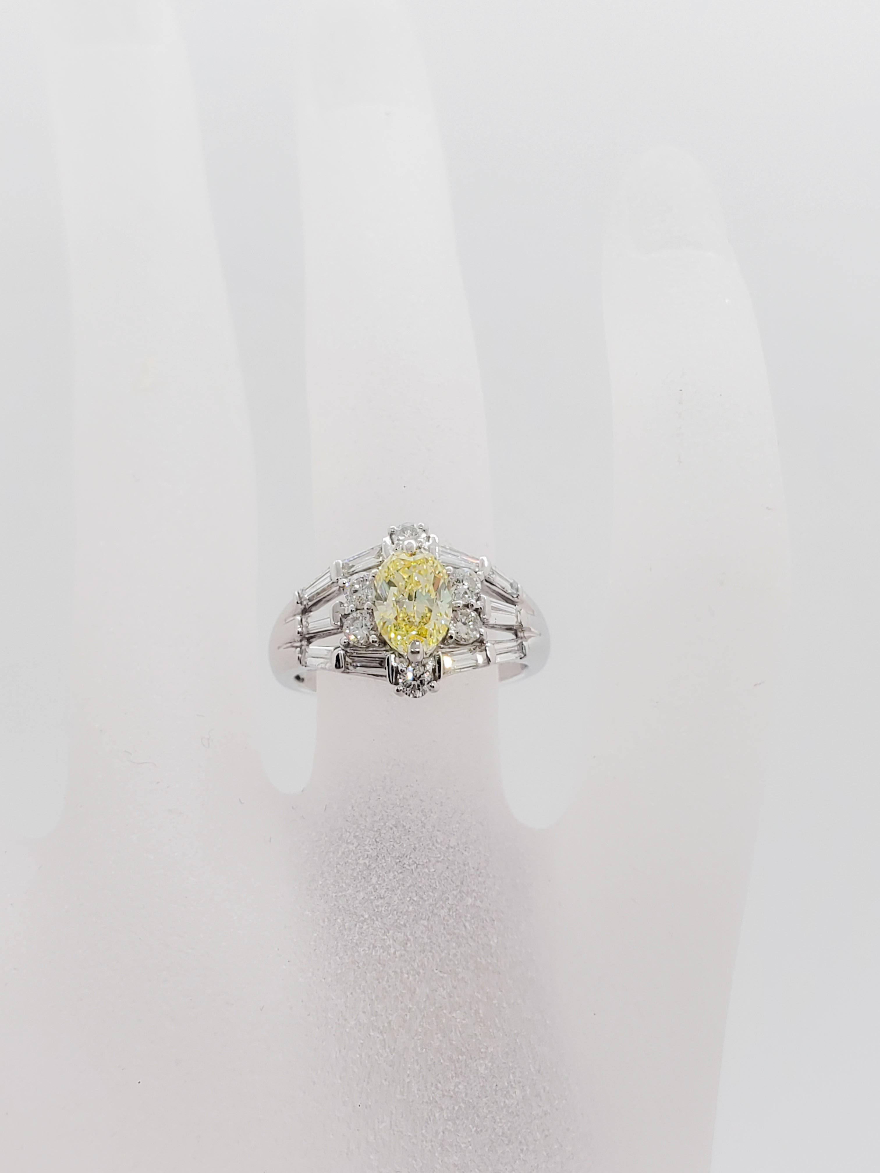 GIA Fancy Yellow Diamond Oval and White Diamond Platinum Ring In New Condition In Los Angeles, CA