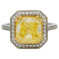 GIA Fancy Yellow Diamond Radiant and White Diamond Ring in 18k