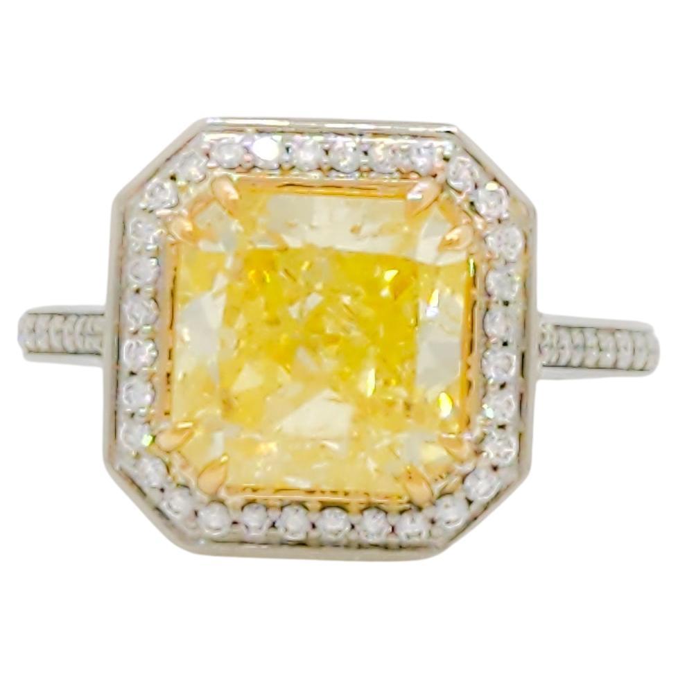 GIA Fancy Yellow Radiant and White Diamond Ring in 18k For Sale