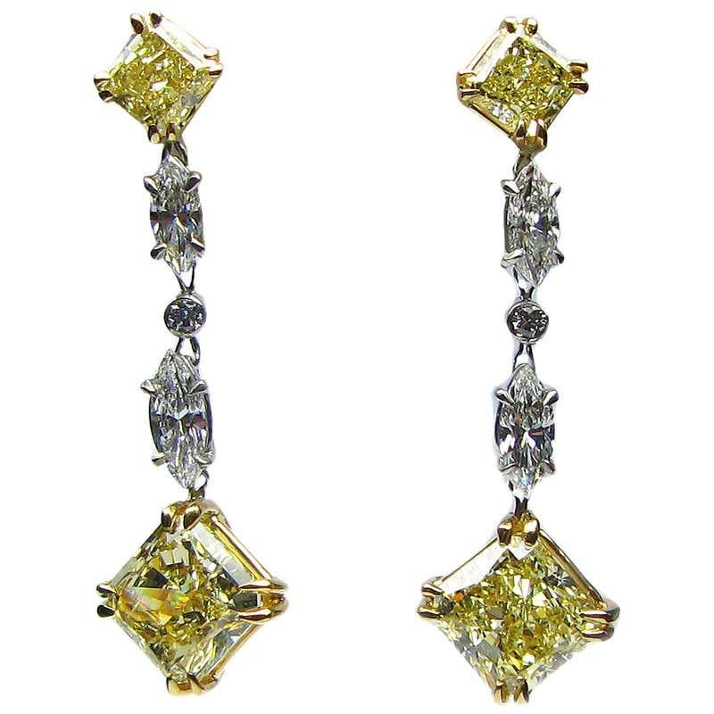 Those handmade J. Birnbach Drop Earrings, crafted in 18kt white and yellow gold, feature two spectacular GIA-certified natural fancy yellow radiant cut diamonds. One weights 1.80 carats, with VVS2 clarity, and the other weighs 1.91 carat with VS1