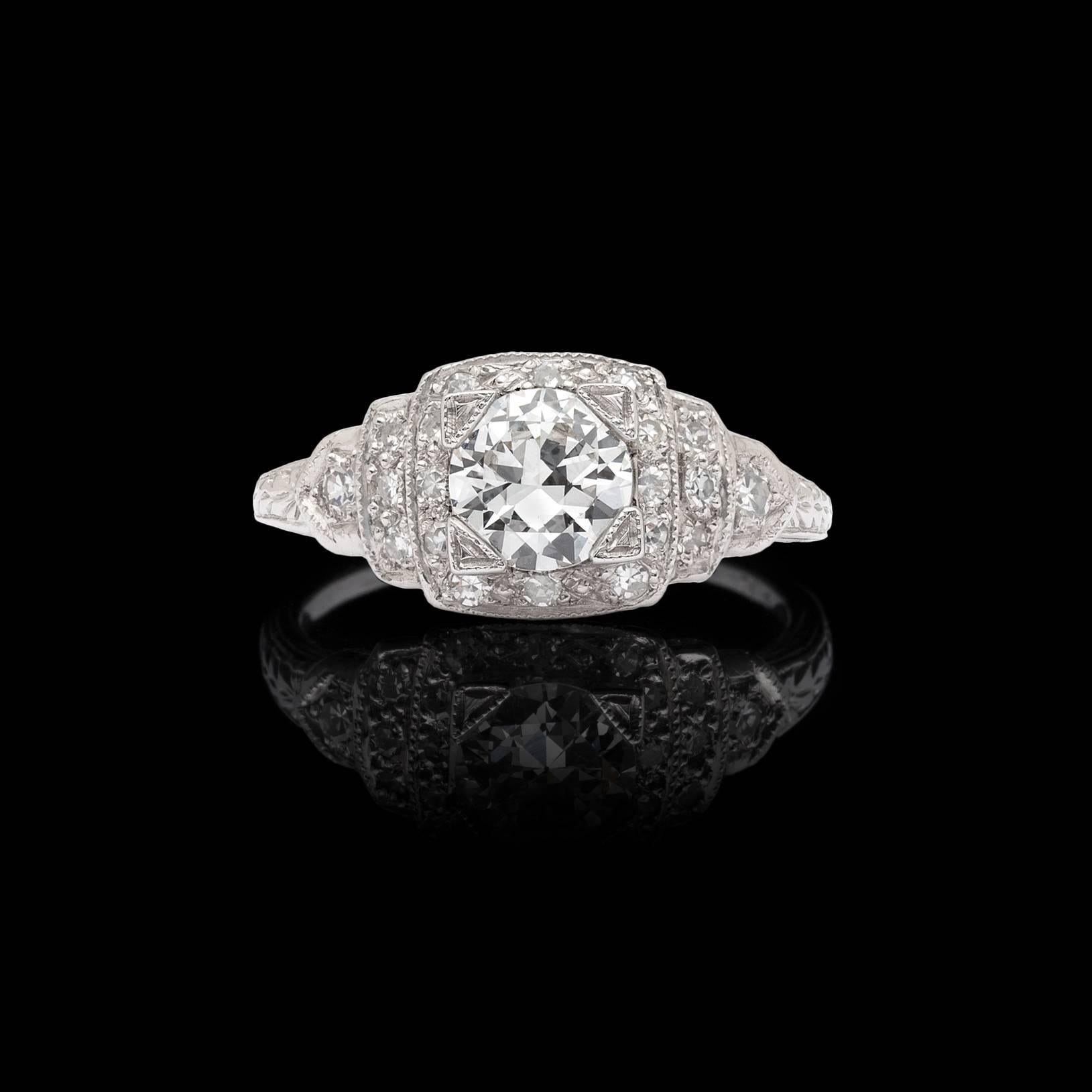 Circa 1950's, the platinum engagement ring features a G/VS2 round brilliant-cut diamond weighing 0.80ct., further accented by single-cut diamonds, for a total weight of 1.05 carats. The ring weighs 4.0 grams, and is currently size 6 3/4, with easy