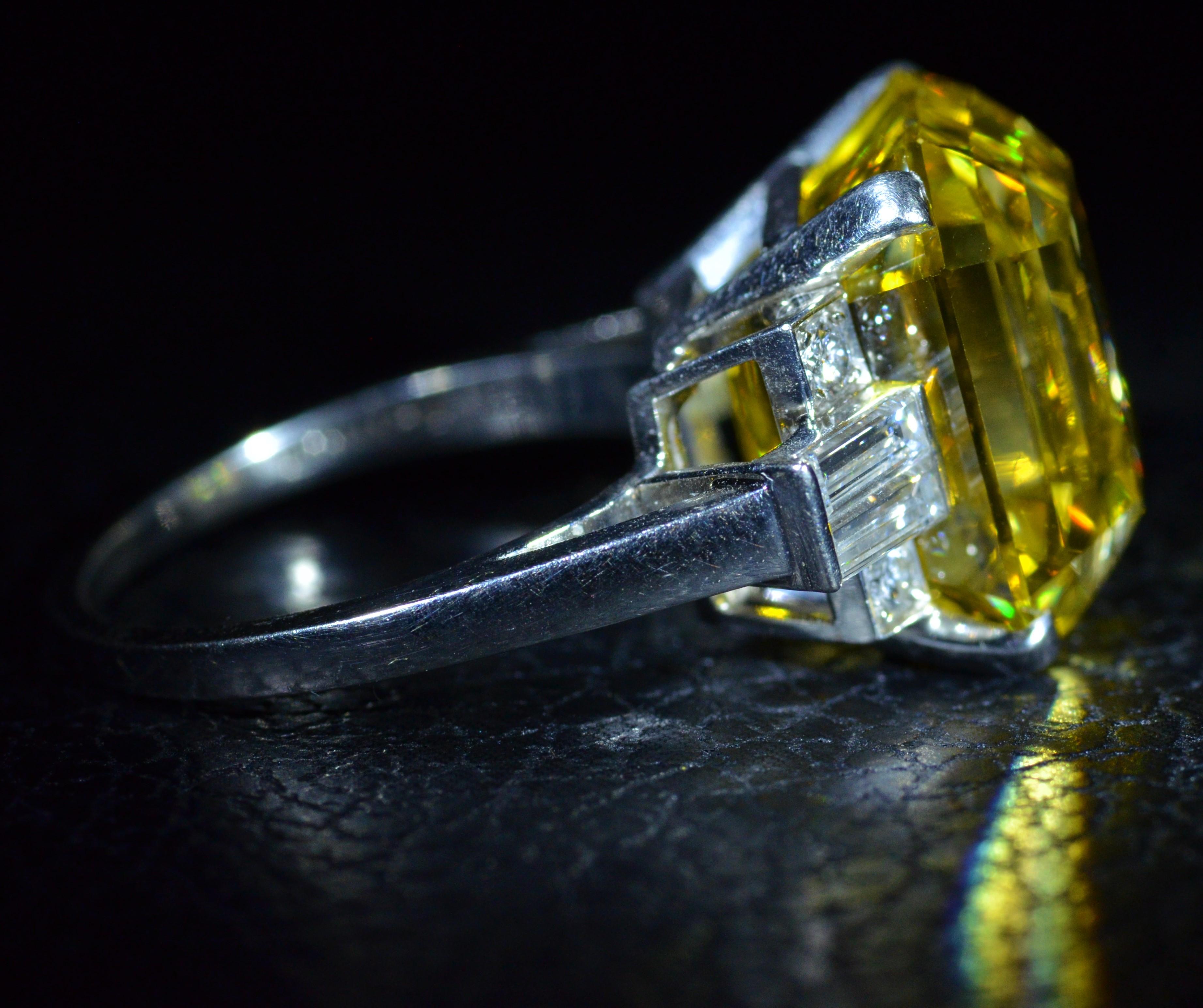 Emerald Cut GIA Graded 19.01 Carat Fancy Vivid Orangy Yellow Vs2 Diamond Ring in Platinum For Sale