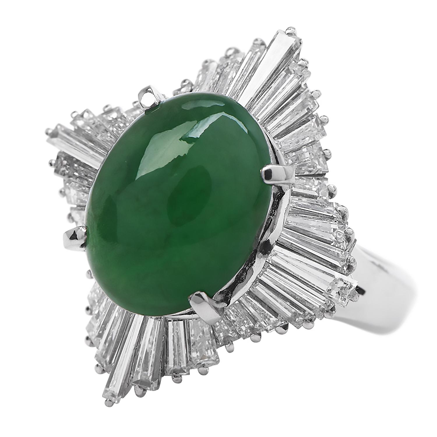 A halo of diamonds surrounds this Natural Color of Green Jade. 

They are crafted in solid Platinum,  Featuring in the center a Cabochon Oval Cut GIA Green Jade of 4.11 carats, natural color without any treatments.

The center stone measuring appx.