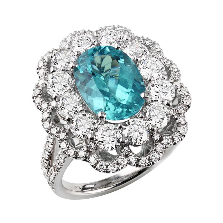 Stunning 3.16 carat oval floral Brazilian Paraiba Tourmaline Ring, accented with 2.87 carat round diamonds. 

A gorgeous one-of-a-kind right-hand ring to add a touch of sparkle and a unique touch to any outfit. An accessory that is sure to be a show