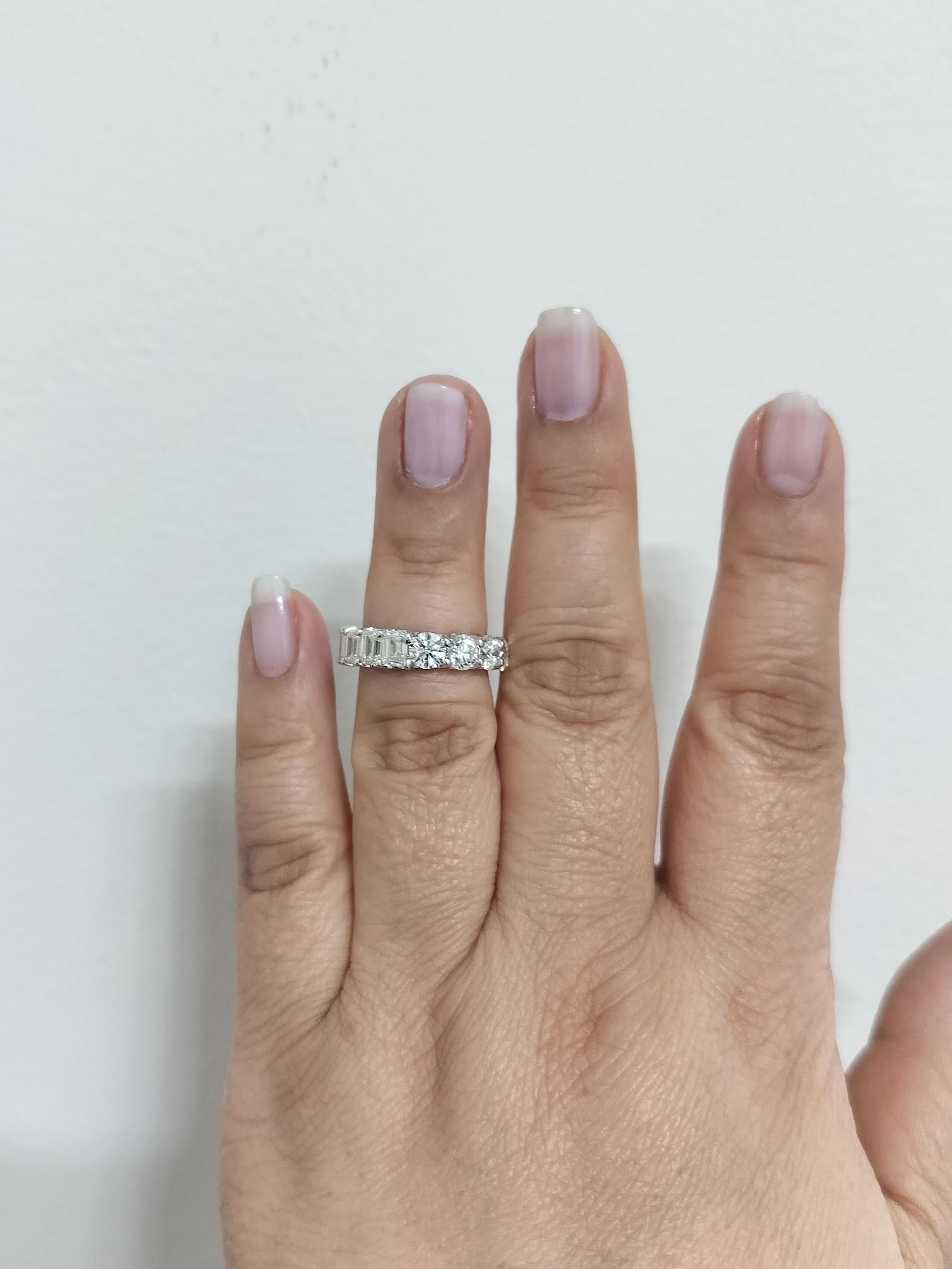 Beautiful and very different 6.40 ct. HI VVS2-SI2 white diamond emerald cut and round diamond eternity band.  Half of it is emerald cuts and half of it is rounds.  This allows the person wearing the band to essentially have 2 bands in 1.  All GIA