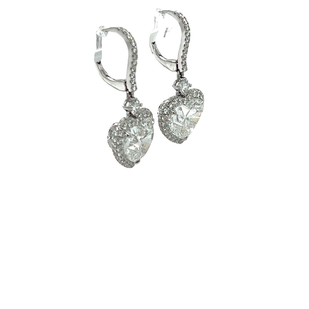 GIA-certified heart shape diamond drop dangle earrings are made with a total of 7.37 carats. to perfection. The heart shape diamonds have been certified by the GIA,  a 3.02 carat F-VS2, and 3.03 carat F-VS2. The heart shape diamonds match perfectly.