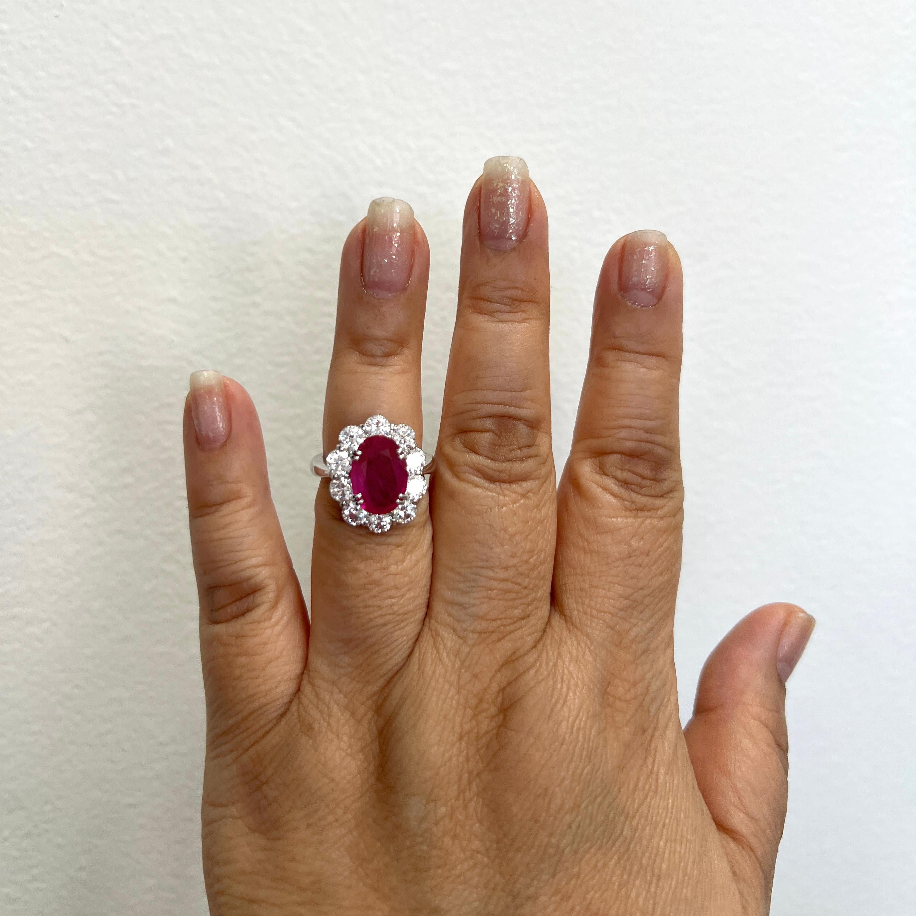 Beautiful 3.94 ct. ruby oval with 2.70 ct. good quality, white, and bright diamond rounds.  Handmade in platinum.  Ring size 6.75.  GIA certificate included.
