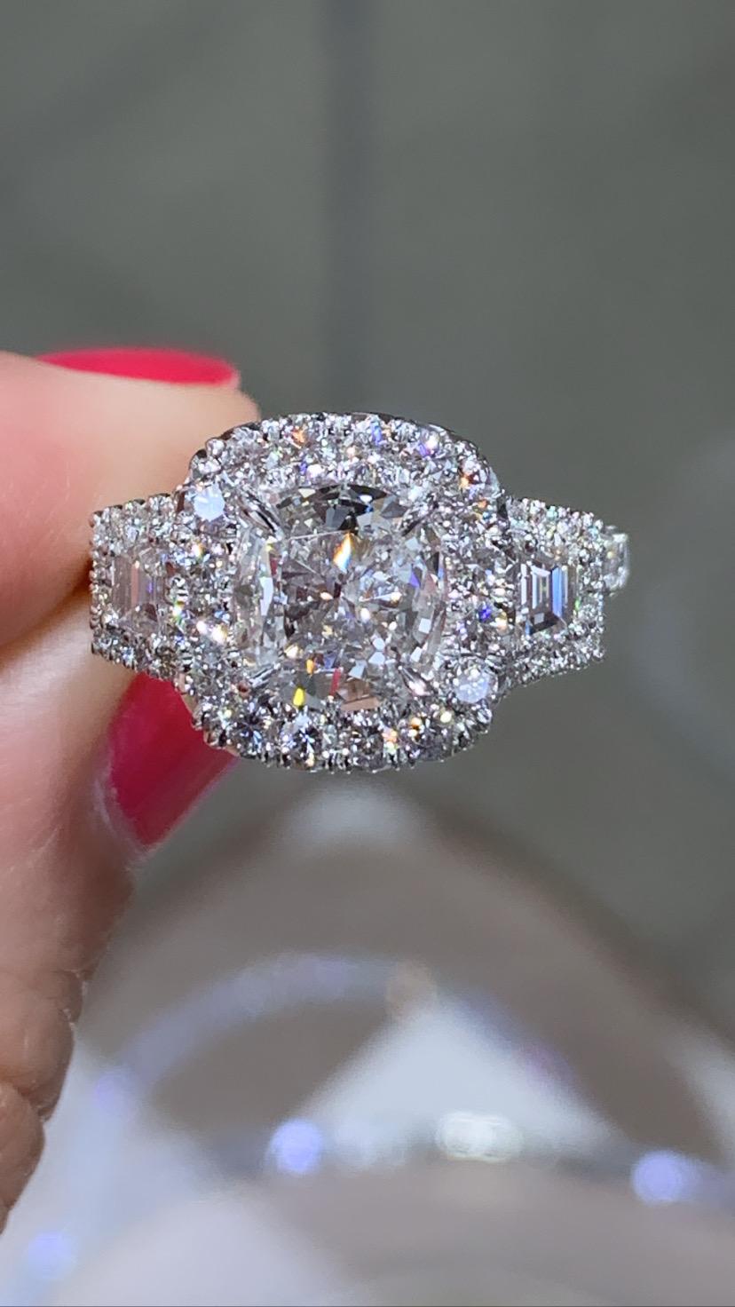 SKU: 122223
You will adore our cushion cut three stone fancy cushion center 1.47ct diamond, side 2 Trapezoid Diamonds 0.30ctw ring because of its fantastic sparkle and shine! Even more, the sparkle is added by pave set round diamonds around each 44