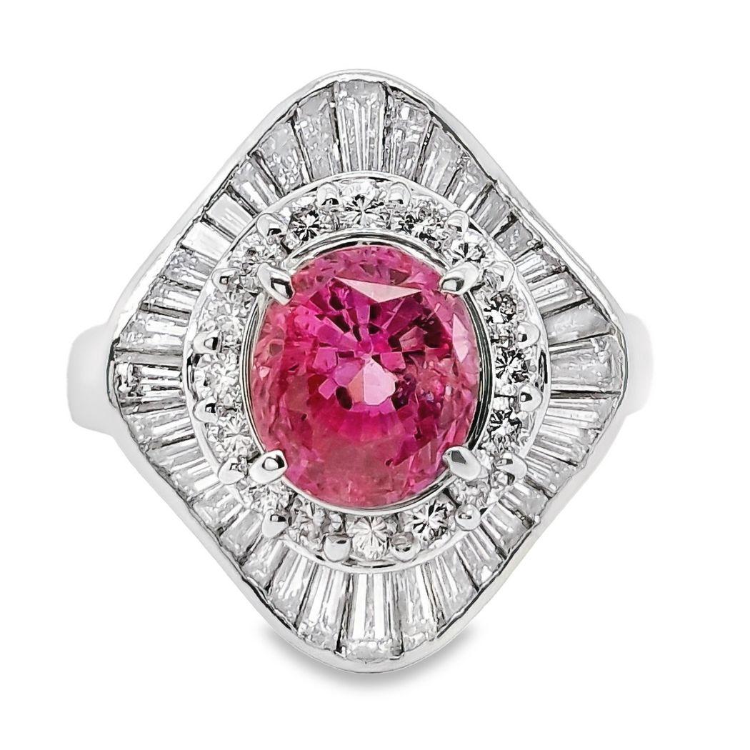 Experience magnificence with our stunning 2.65-carat oval-cut pink sapphire, boasting fine color quality and adorned by 51 round brilliant and tapered baguette diamonds. This exceptional piece, weighing 10.02 grams, is set on a platinum ring,