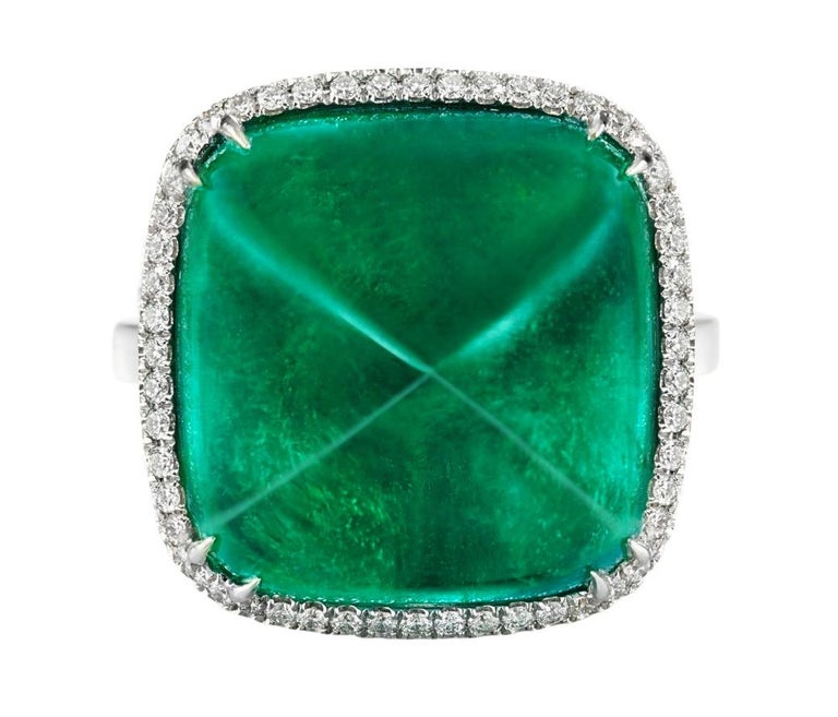 This exquisite sugarloaf cabochon emerald is surrounded by round brilliant cut pave diamond bezel
The main stone has been certified by IGI Antwerp as minor oil and by GIA 
Round diamond 1.50 cts
This ring is a size 7 but can be sized upon requesT