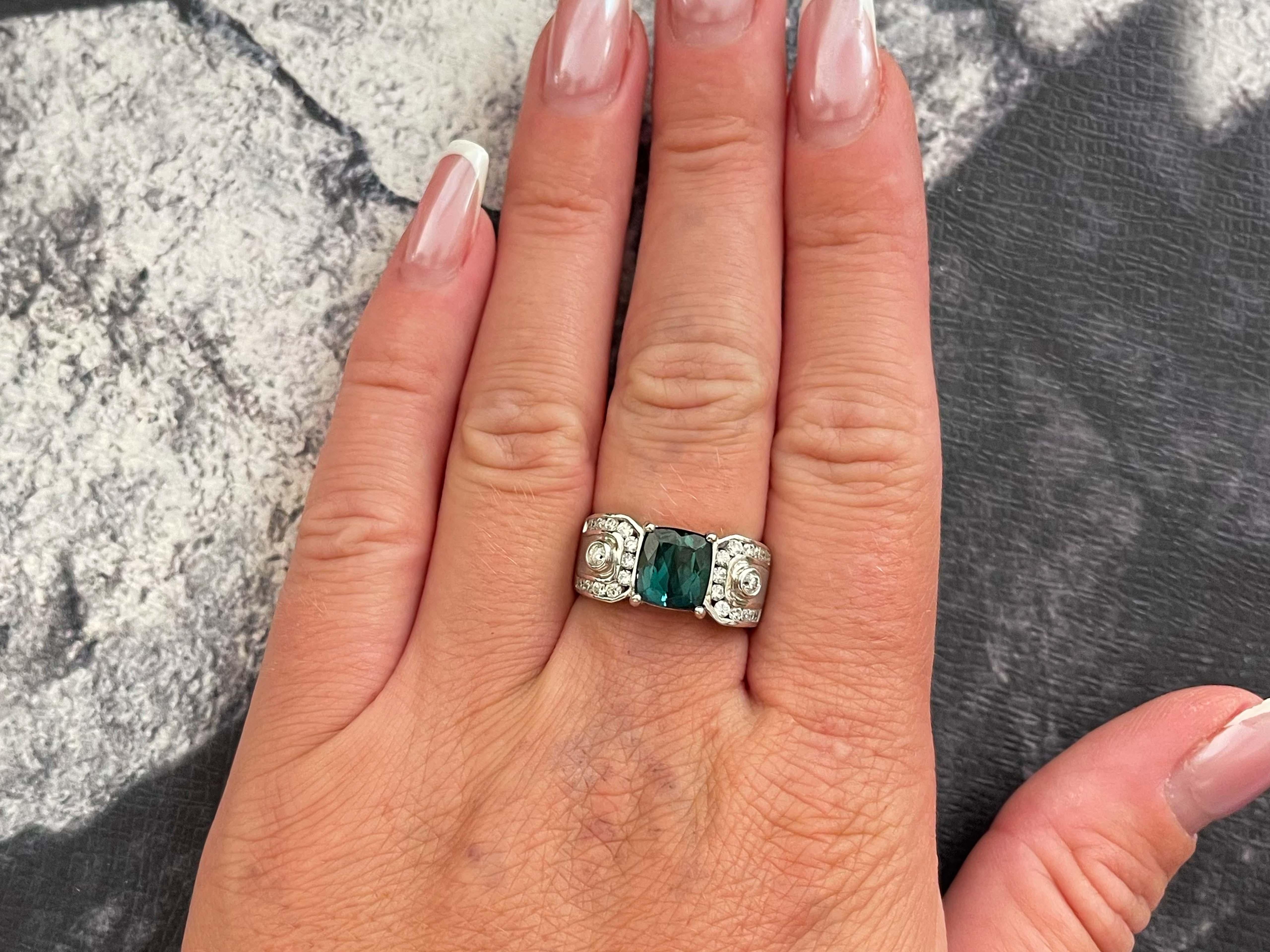 Ring Specifications:

Metal: 14K White Gold

Weight: 8.72 grams

Ring Size: 7 (Free Resizing Available)

Center Gemstone Specifications:

Gemstone GIA Report #: 6237037943

Species: Tourmaline 
