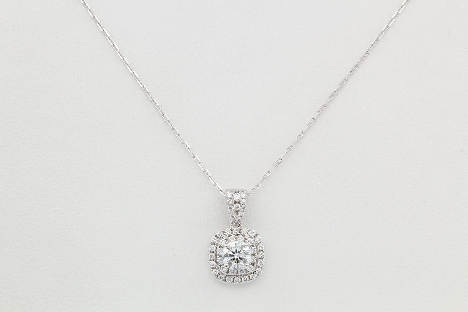 We are pleased to present this Ladies GIA Certified 18k White Gold & Round Brilliant Diamond Pendant Necklace 0.85ctw. This cute piece features a GIA certified and laser inscribed 0.46ct G/Internally Flawless round brilliant cut diamond set in a 18k