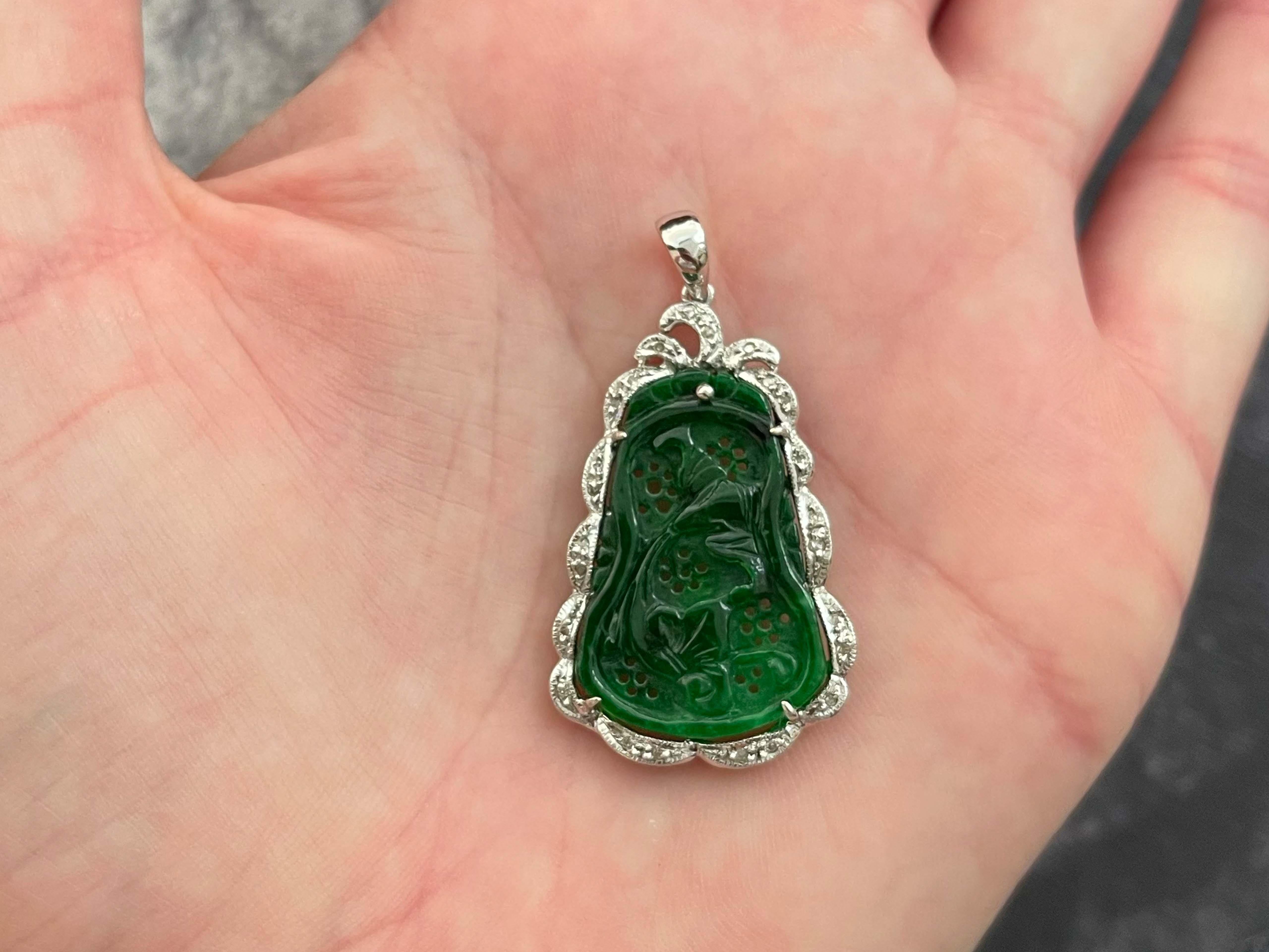 Item Specifications:

Metal: 14k White Gold

Pendant Measurements with Bail: 41 mm x 22 mm

Total Weight: 3.92 Grams

Lab Report: GIA

GIA Report #:  5231035376

Gemstone Specifications:

Species: Jadeite Jade

Shape: Pierced Carving

Transparency: