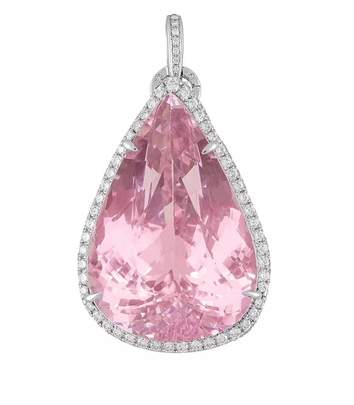 GIA Certified 149.31 carat Kunzite Pearshape Pendant and Diamond Necklace in Platinum and 18k White Gold

Kunzite and Diamond Pendant features a Natural 149 carat Pear-shaped Pink Kunzite set in Platinum with a Diamond Halo and Diamond Gallery on an