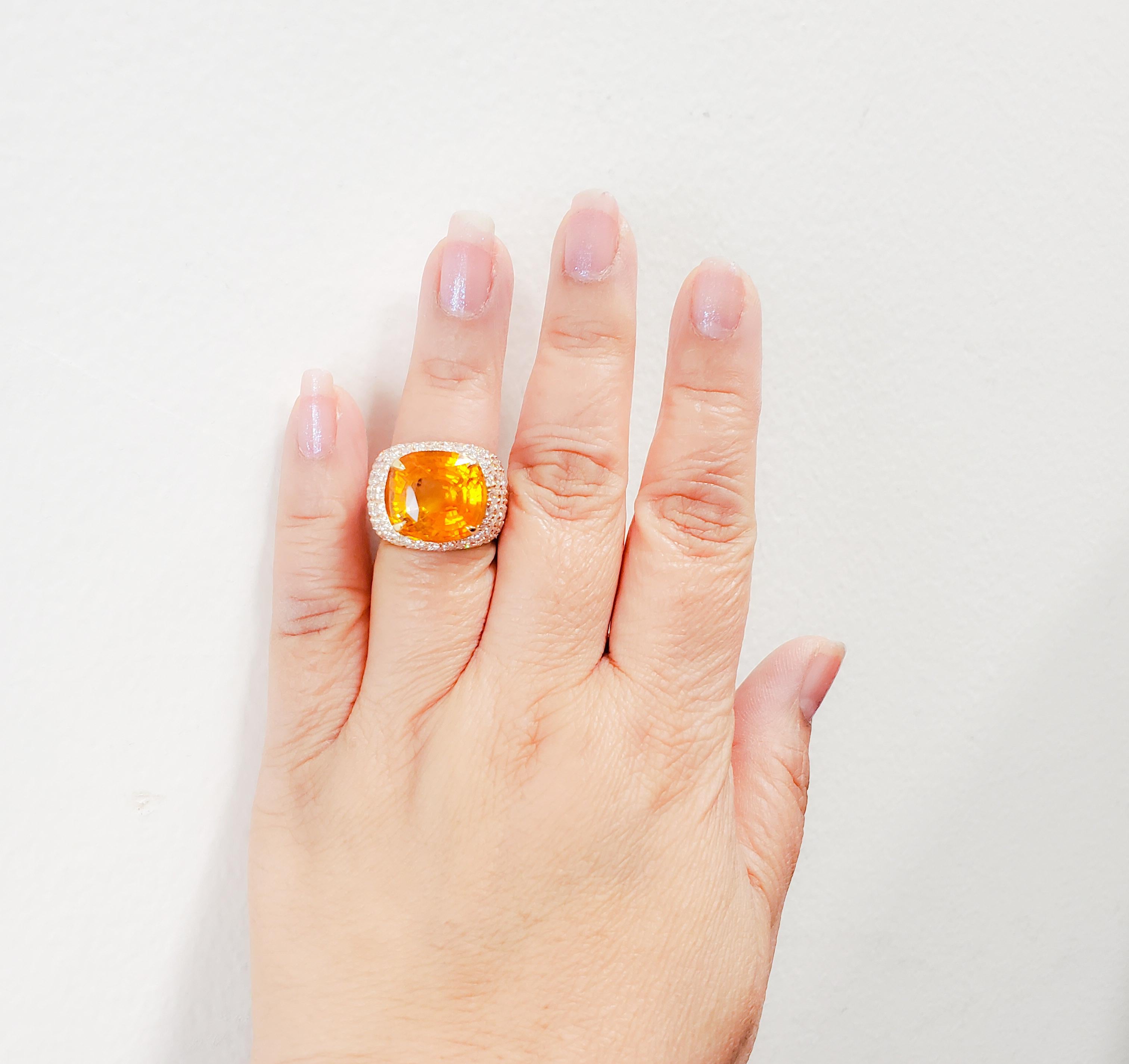 Amazing 18.58 ct. orange sapphire cushion with 5.50 ct. good quality white diamond rounds.  Handmade in 18k rose gold.  Ring size 6.75.  GIA certificate included.
