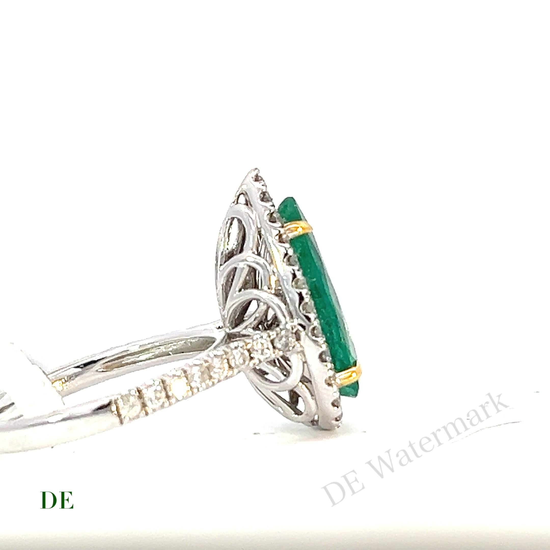This luscious green emerald and diamond ring is an absolute showstopper that exudes luxury and elegance. The centerpiece of the ring is a stunning GIA certified natural green emerald that weighs approximately 3.94 carats. The emerald's color is