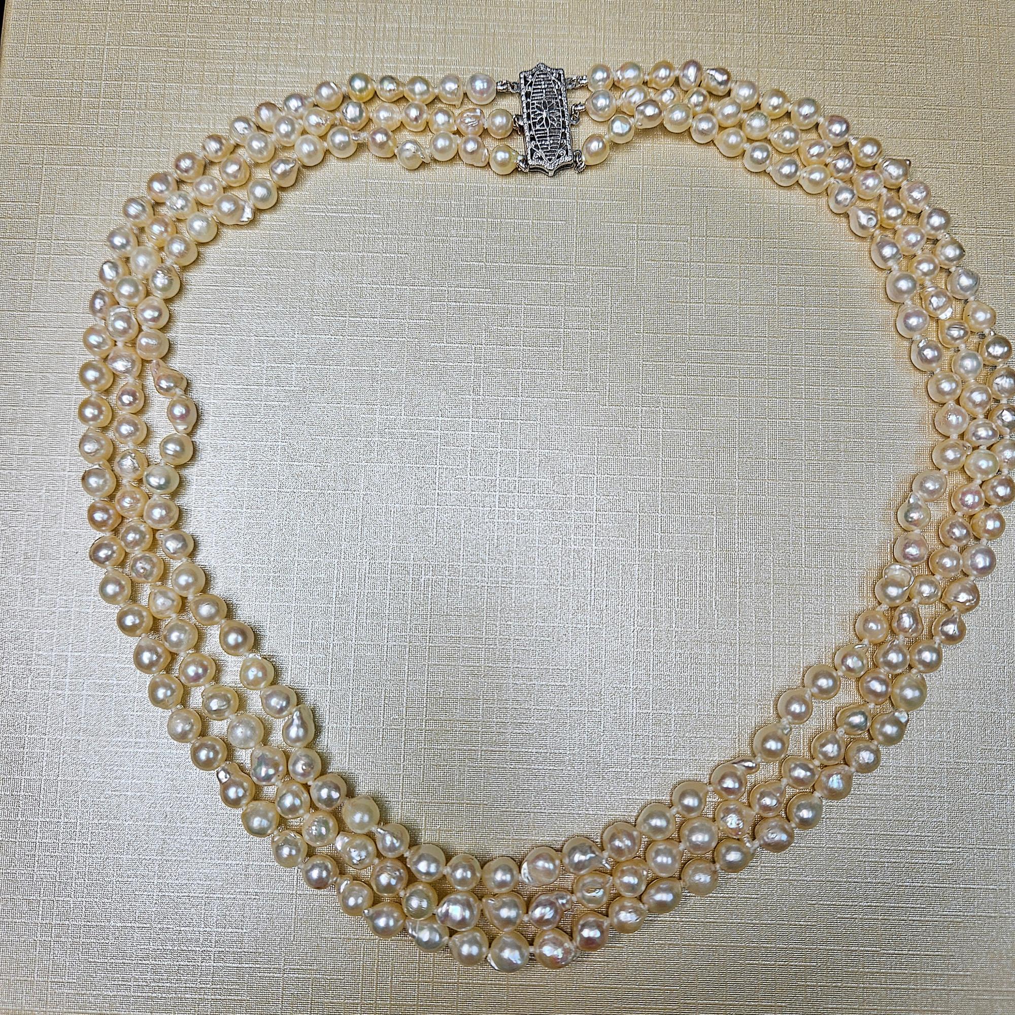 GIA 3-Strand Saltwater Akoya Baroque Japanese Pearl 14K White Gold Vintage Necklace; Multi Strand Pearl Necklace.
Discover the Beauty of Imperfection ✨
These stunning vintage saltwater baroque light cream Akoya pearls are a true testament to the