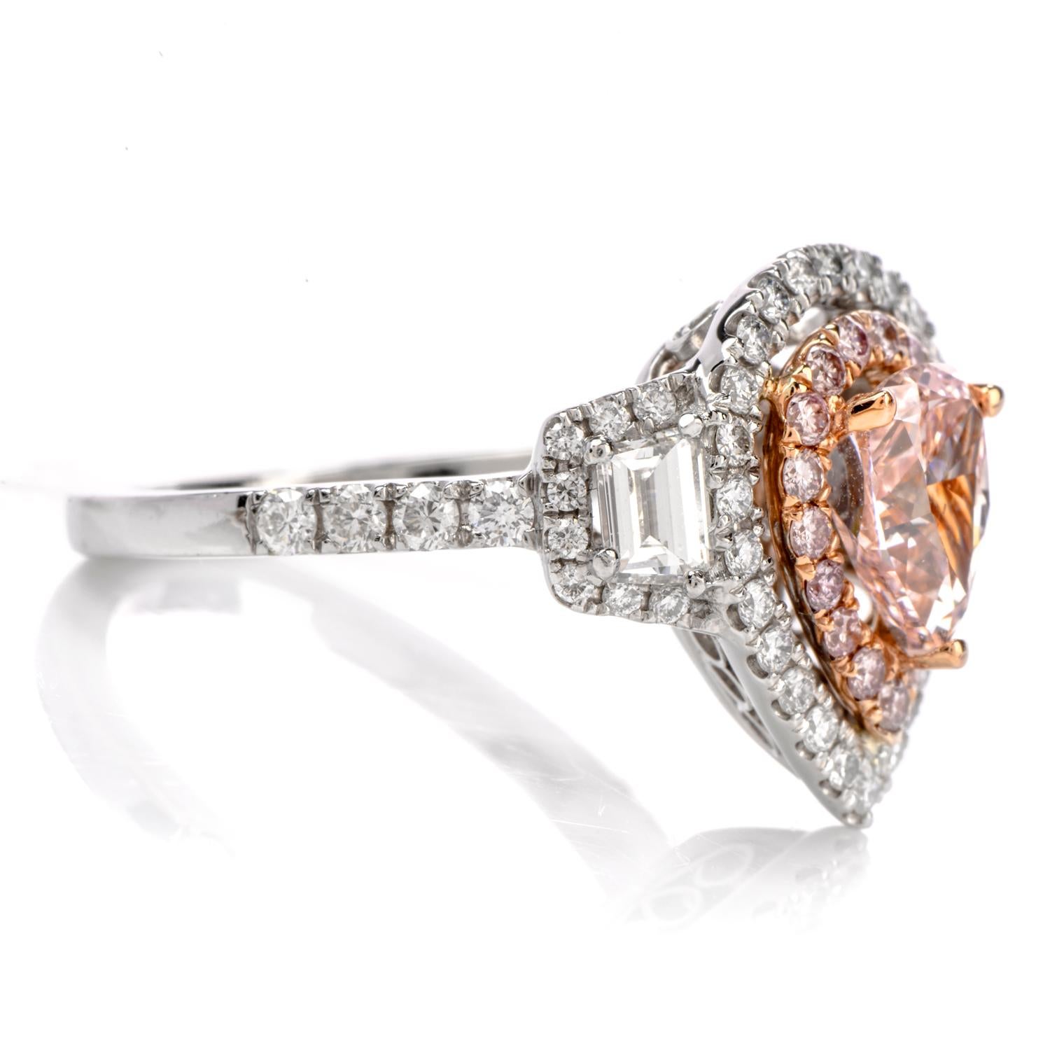 Tickle Her Pink with this vintage inspired Engagement RIng

crafted in luxurious Platinum.

Adorning the center is one pear shaped GIA certified Natural Fancy

Orangy Pink pear shaped diamond measuring appx. 7.28 x 5.07 x 3.74mm and

weighing appx.