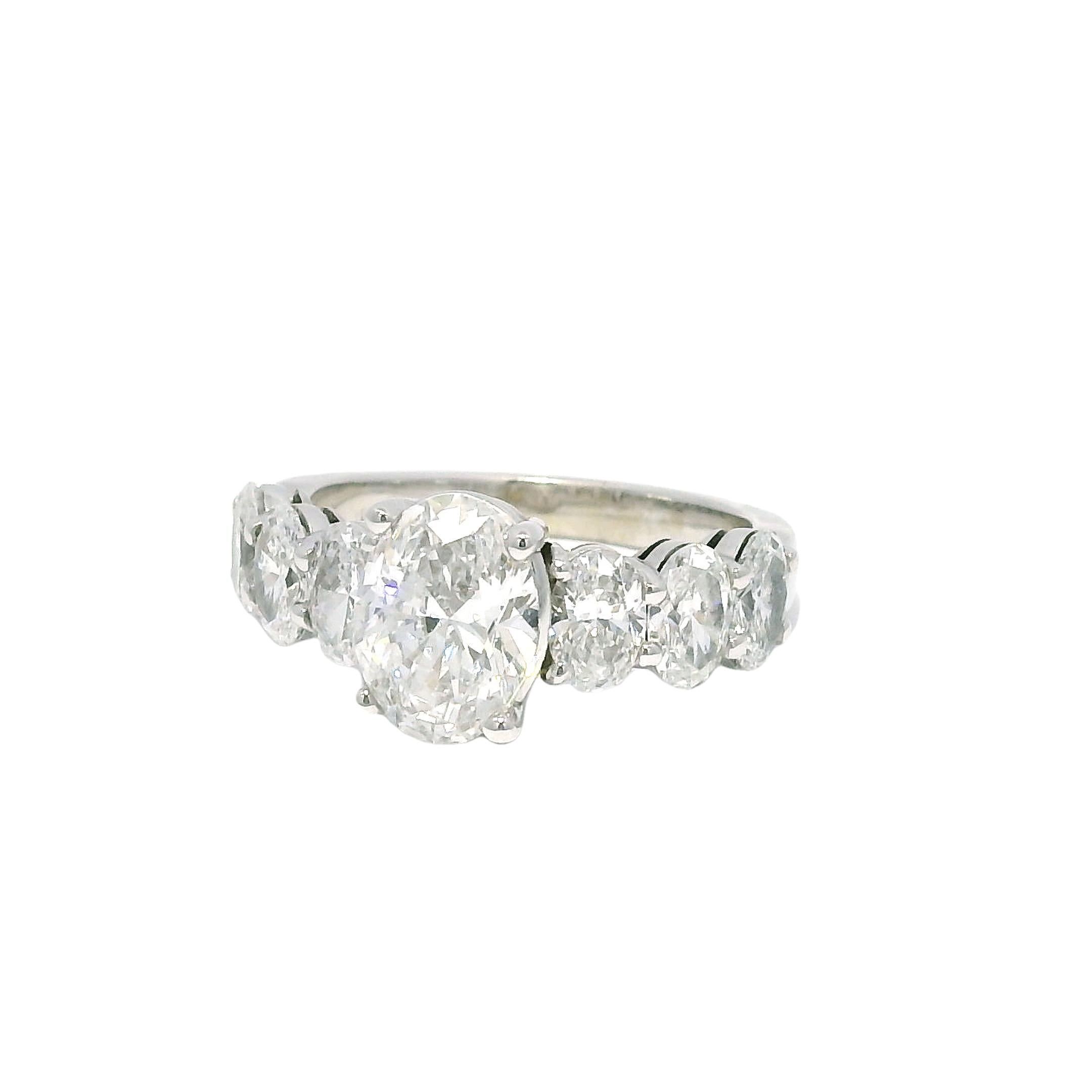 Modern GIA Natural 1.52 Carat Oval Cut Diamond, 7 Stone 18-Karat Ring In Stock For Sale