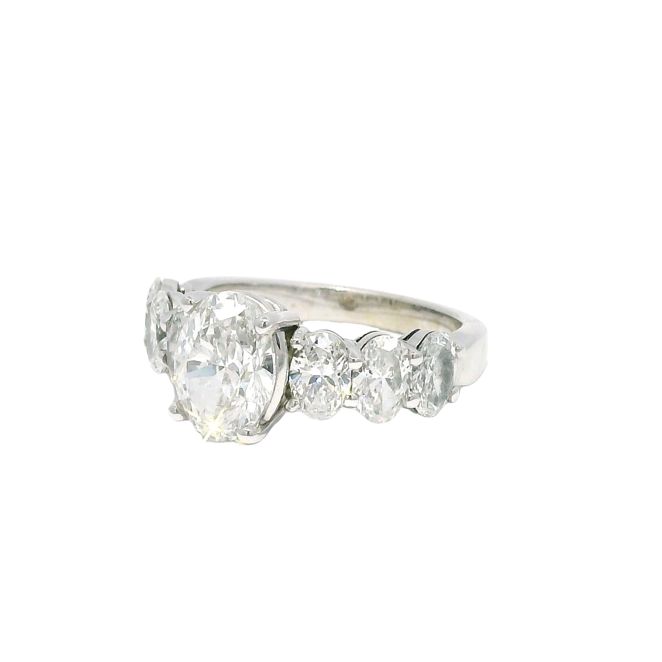 Round Cut GIA Natural 1.52 Carat Oval Cut Diamond, 7 Stone 18-Karat Ring In Stock For Sale