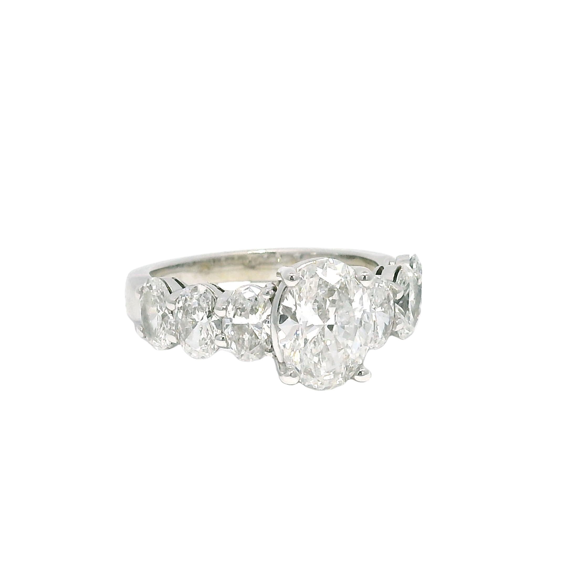 Women's GIA Natural 1.52 Carat Oval Cut Diamond, 7 Stone 18-Karat Ring In Stock For Sale