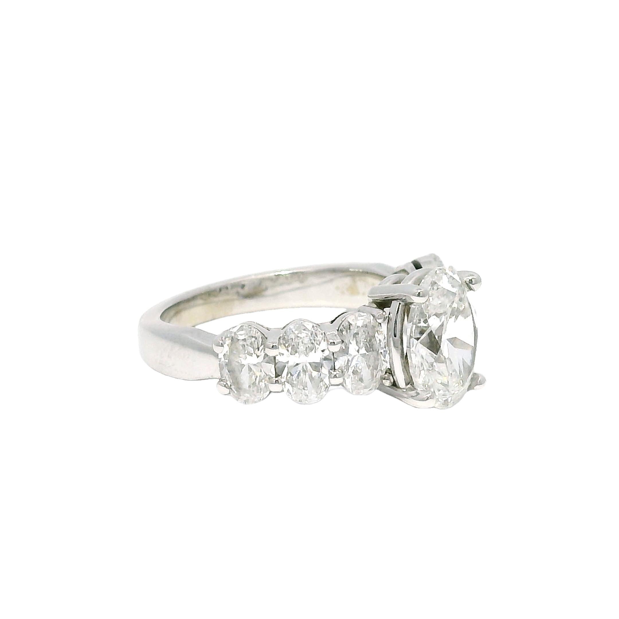 GIA Natural 1.52 Carat Oval Cut Diamond, 7 Stone 18-Karat Ring In Stock For Sale 2