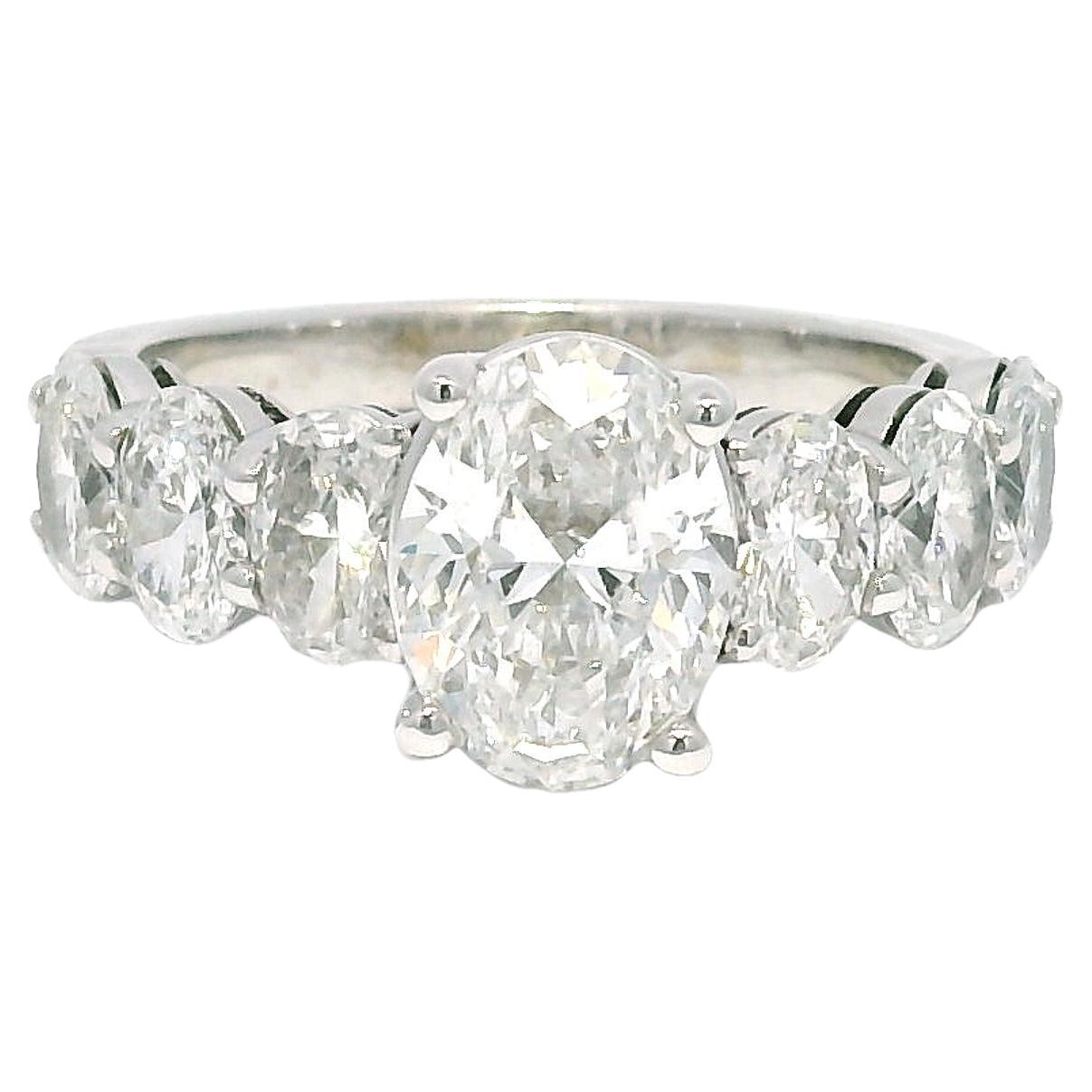 GIA Natural 1.52 Carat Oval Cut Diamond, 7 Stone 18-Karat Ring In Stock For Sale