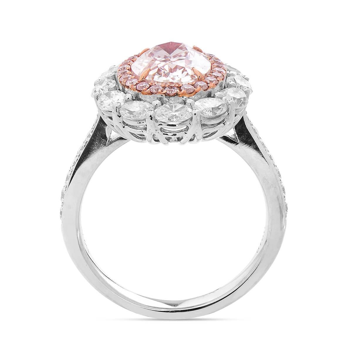 This one of a kind piece hosts one 2.01 Carat Light Pink Diamond and is set in a double halo of natural pink and white diamonds, together making up 3.50 Carats. This piece was expertly crafted using 18 Karat White Gold. GIA certified. 
Natural pink