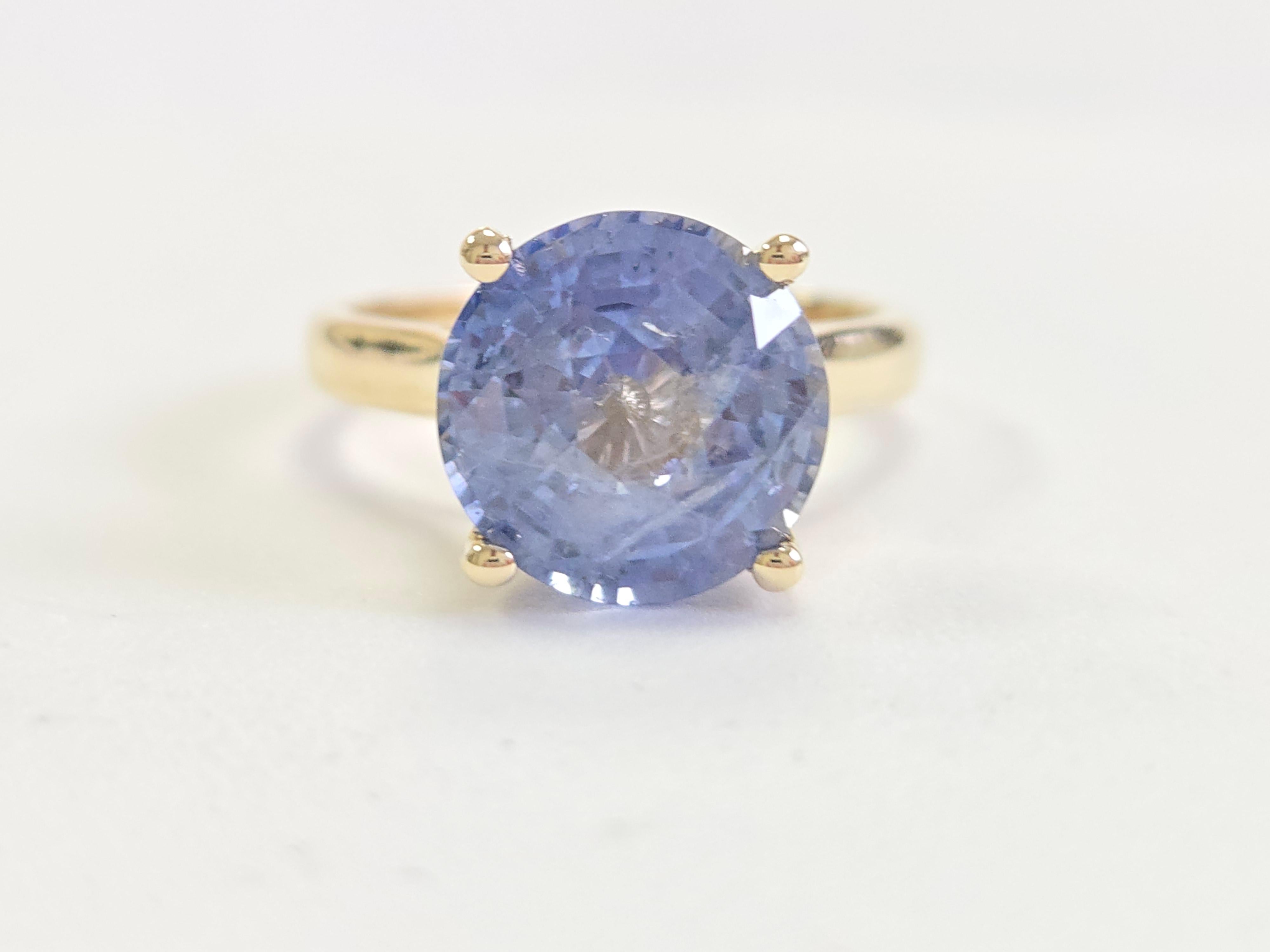 Exquisite GIA Certified Natural Sapphire Ring – 5.60 Carats

This stunning ring features a brilliant, 5.60-carat natural sapphire that is GIA certified, ensuring its authenticity and exceptional quality. The sapphire is cut into a round shape,