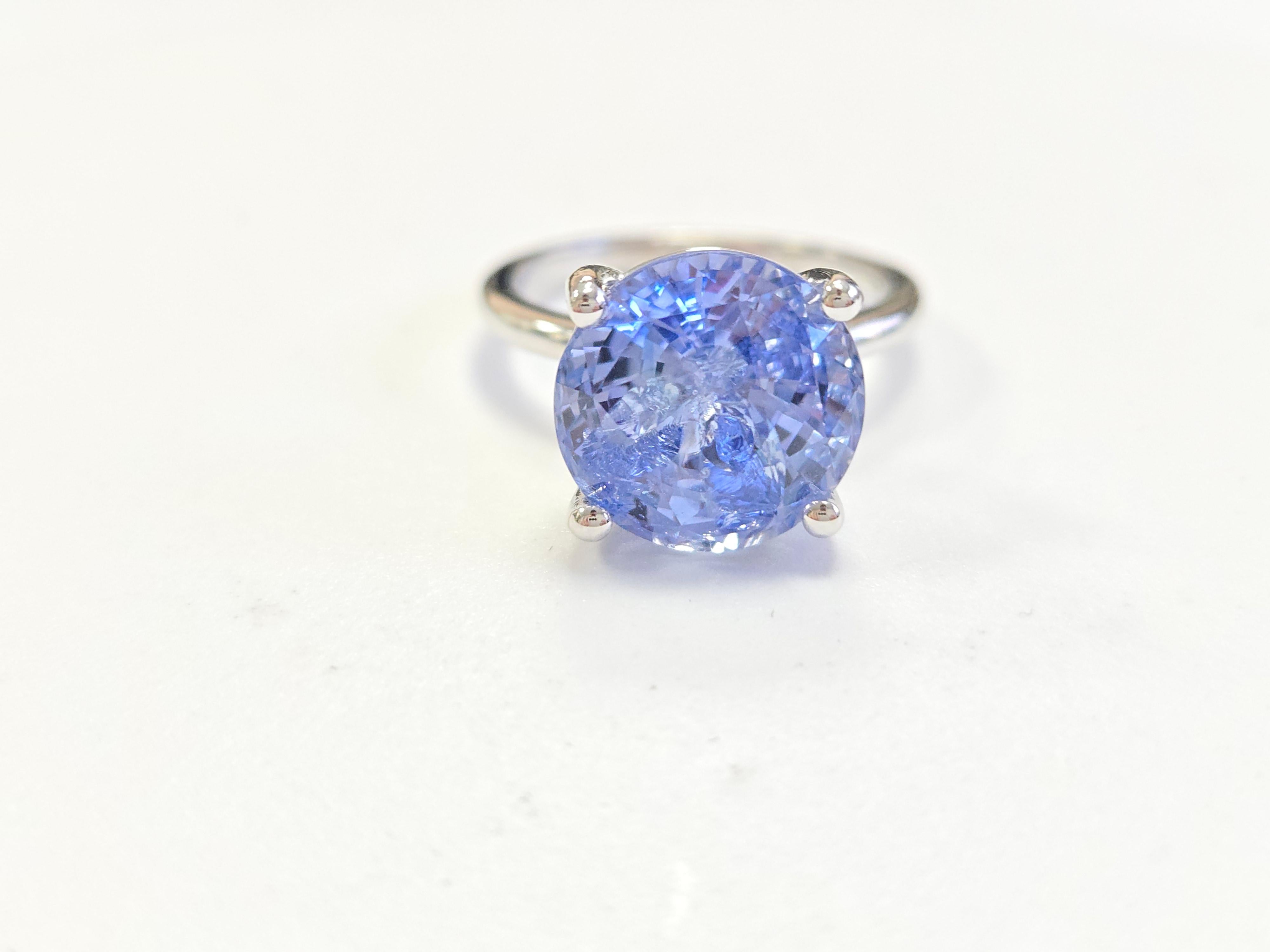 GIA Certified Natural 8.48 Carat Round Shape Sapphire Ring in 14K White Gold

This exquisite sapphire ring showcases an impressive 8.48-carat natural sapphire, certified by GIA for its authenticity and quality. The vibrant round shape of the