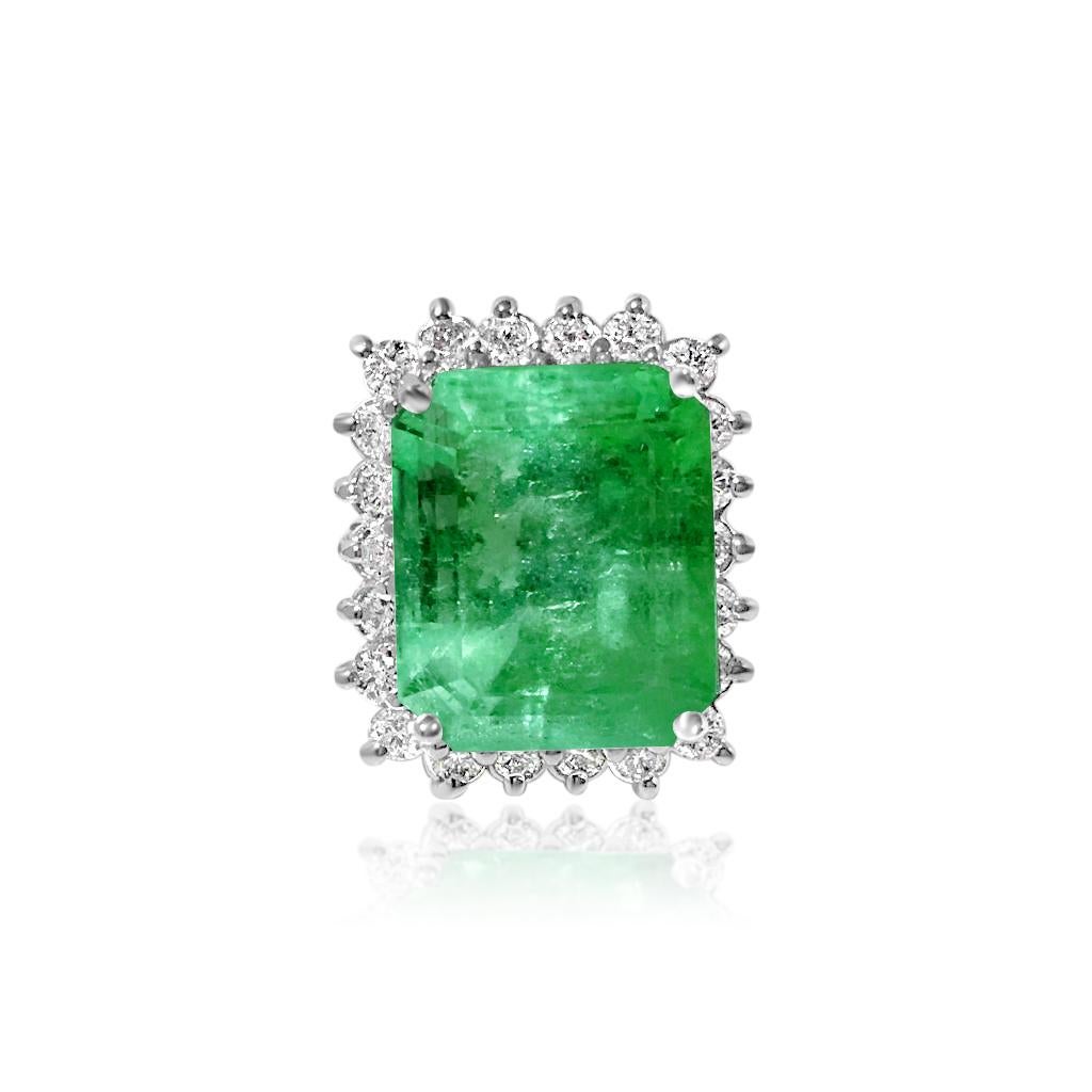 Metal: 14k white gold. 

20.00 carats emerald. 100% natural earth mined emerald. Origin: Colombian. Cut: Emerald shape. Prong setting. Deep luster and shine. Great saturation and color. 

Diamond: 2.20 carats total. Round brilliant cut. F color, VS