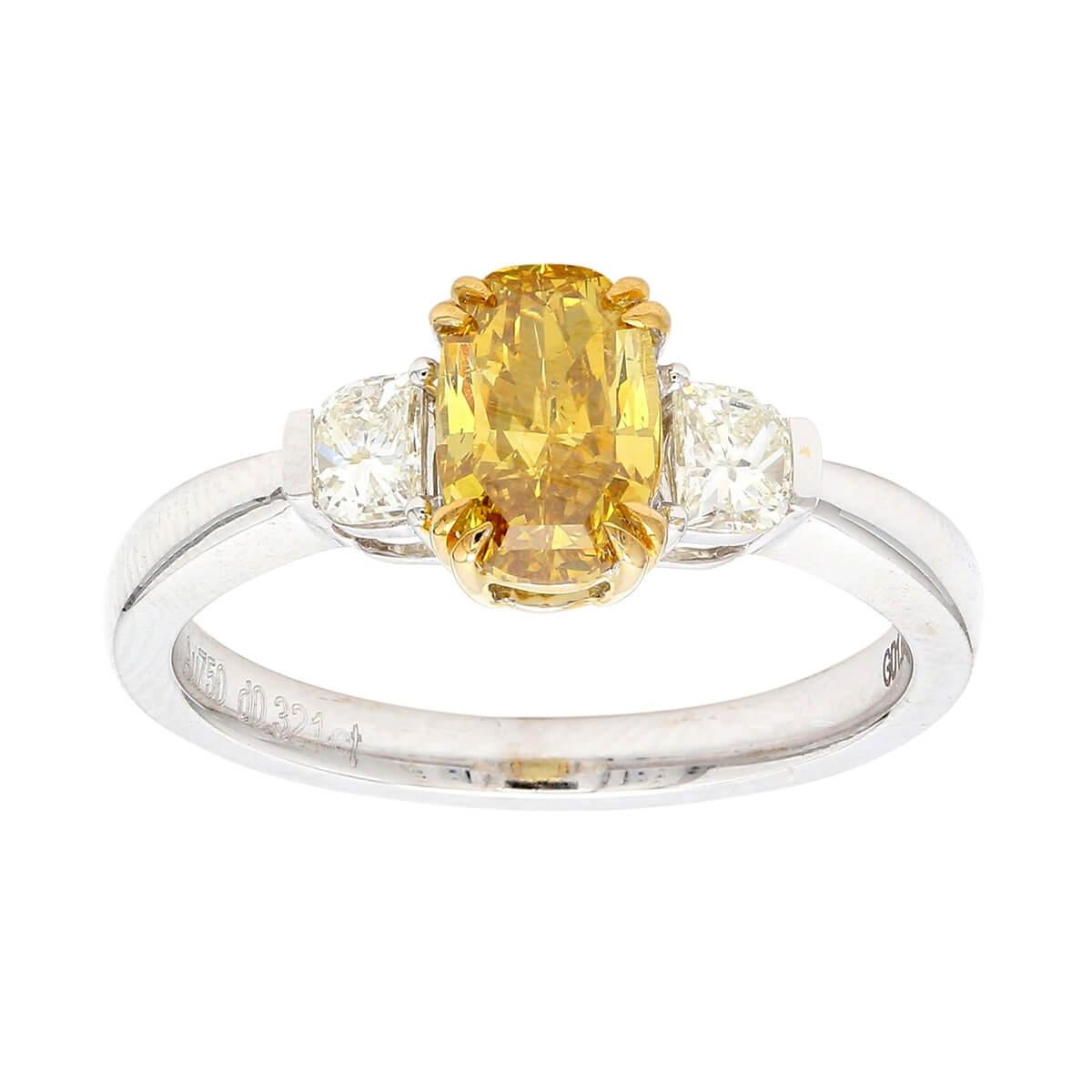This elegant cocktail ring consists of a main stone which is a 1.05 Fancy Deep Orangy Yellow Diamond, surrounded by White Diamonds together makes up a total of 1.37 Carats and is expertly made using 18 Karat White Gold. The Diamond are natural and