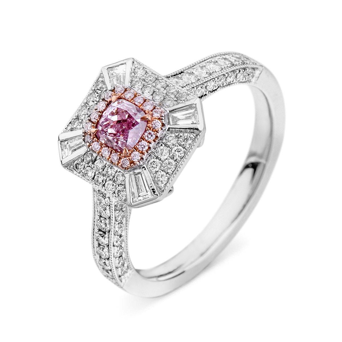 This Fancy Pink Purple Diamond Ring hosts a main 0.33 Carat pink purple diamond, surrounded by white diamonds, together making a total of 0.92 carats. A beautiful, cushion shape, expertly crafted using 18 Karat White Gold. 
The diamonds are all