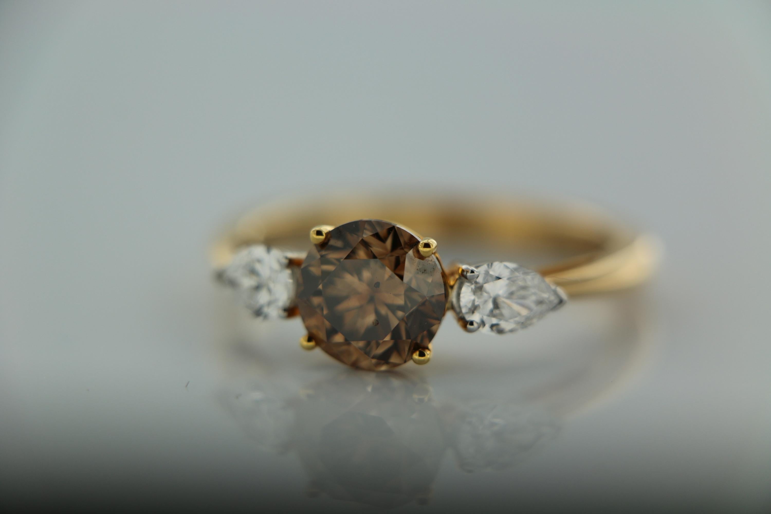 Contemporary GIA Natural Fancy Yellowish Brown Round Brilliant And Pear Diamond Ring In 18 K  For Sale