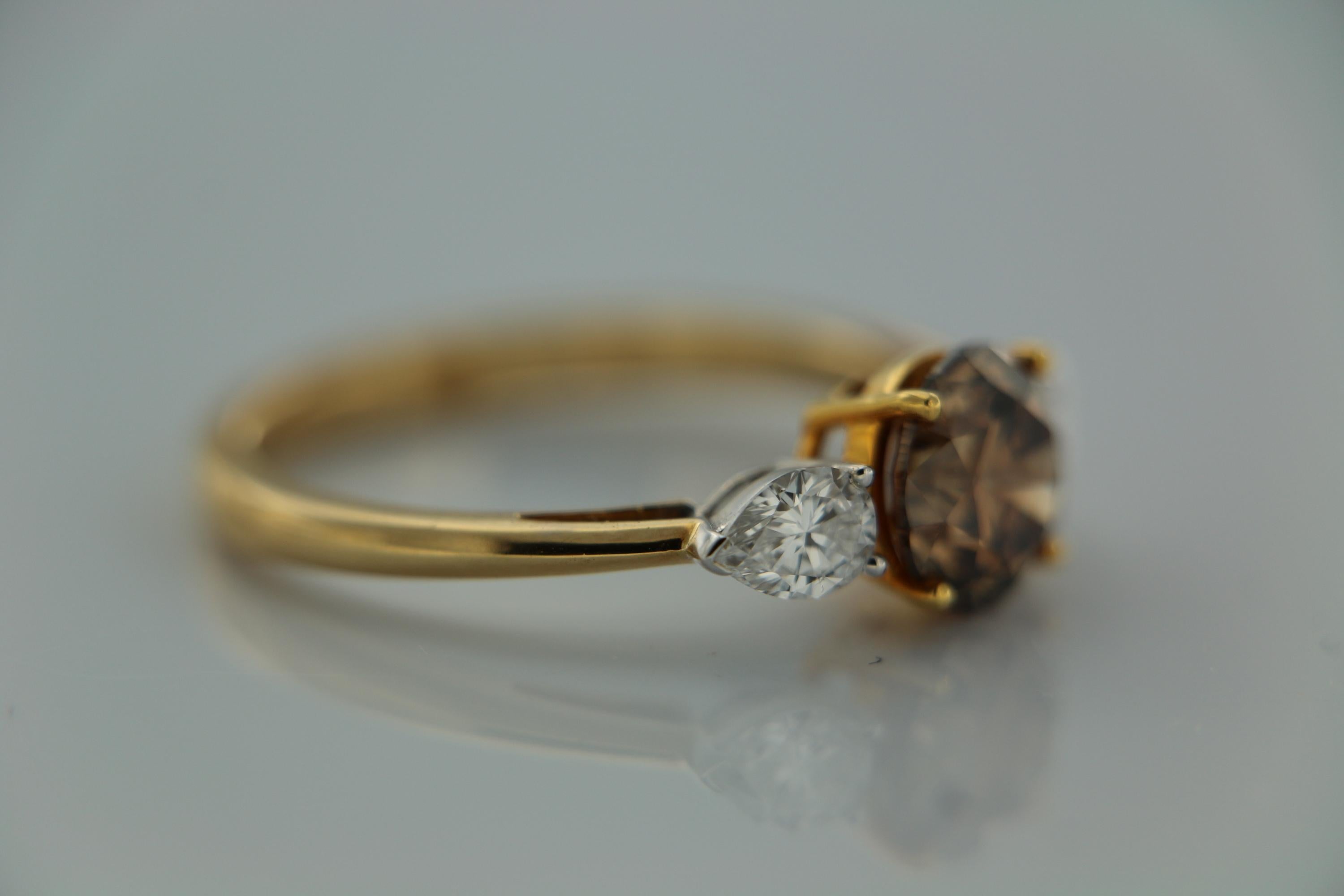 GIA Natural Fancy Yellowish Brown Round Brilliant And Pear Diamond Ring In 18 K  In New Condition For Sale In New York, NY