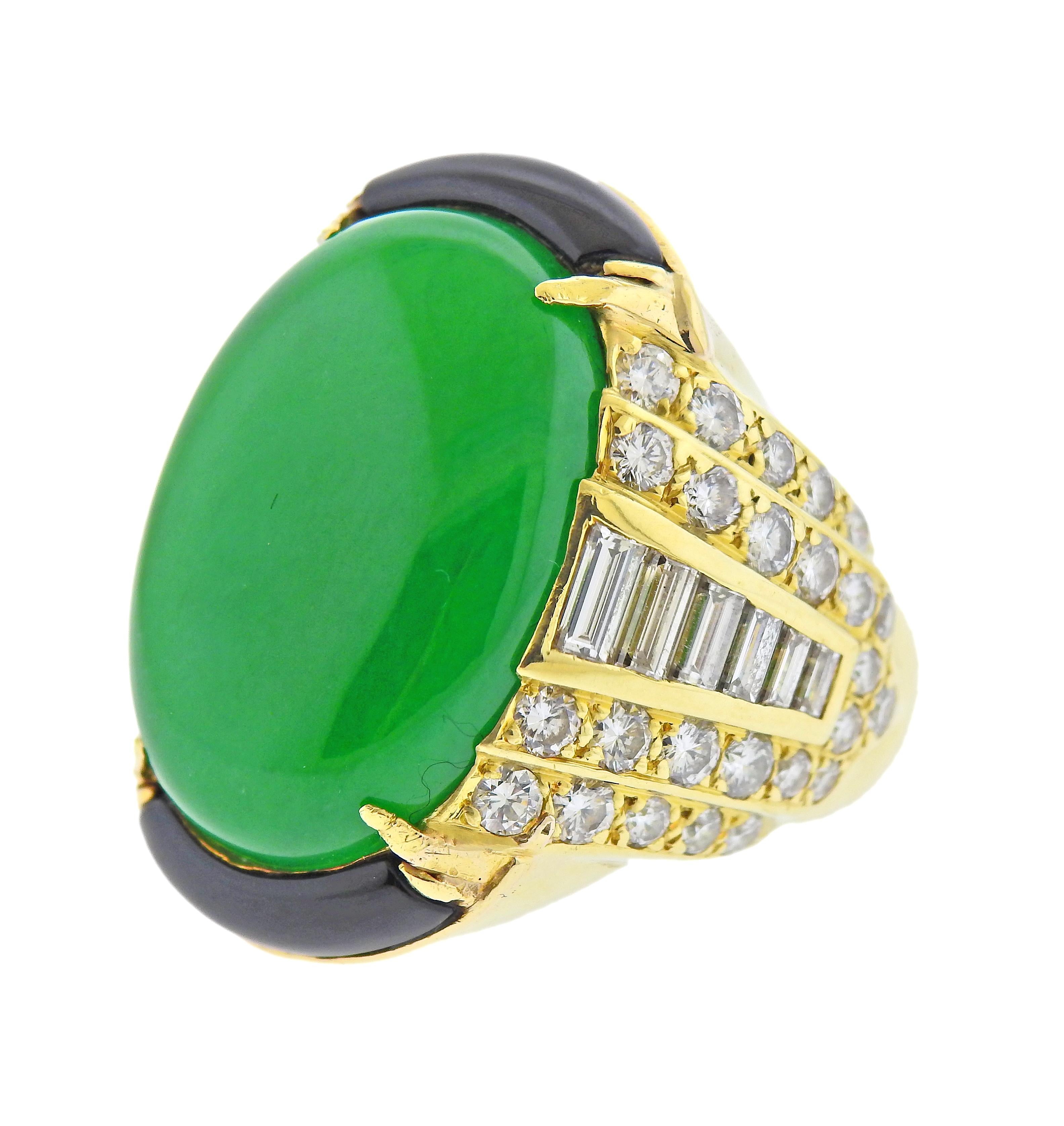 GIA certified natural jadeite jade cabochon, measuring 24.21 x 17.21 x 6.00mm, set in 18k gold ring, surrounded with onyx and approx. 3.00ctw in diamonds. Ring size - 7.5, ring top is 30mm wide. Marked: 18k. Weight - 29.8 grams. 