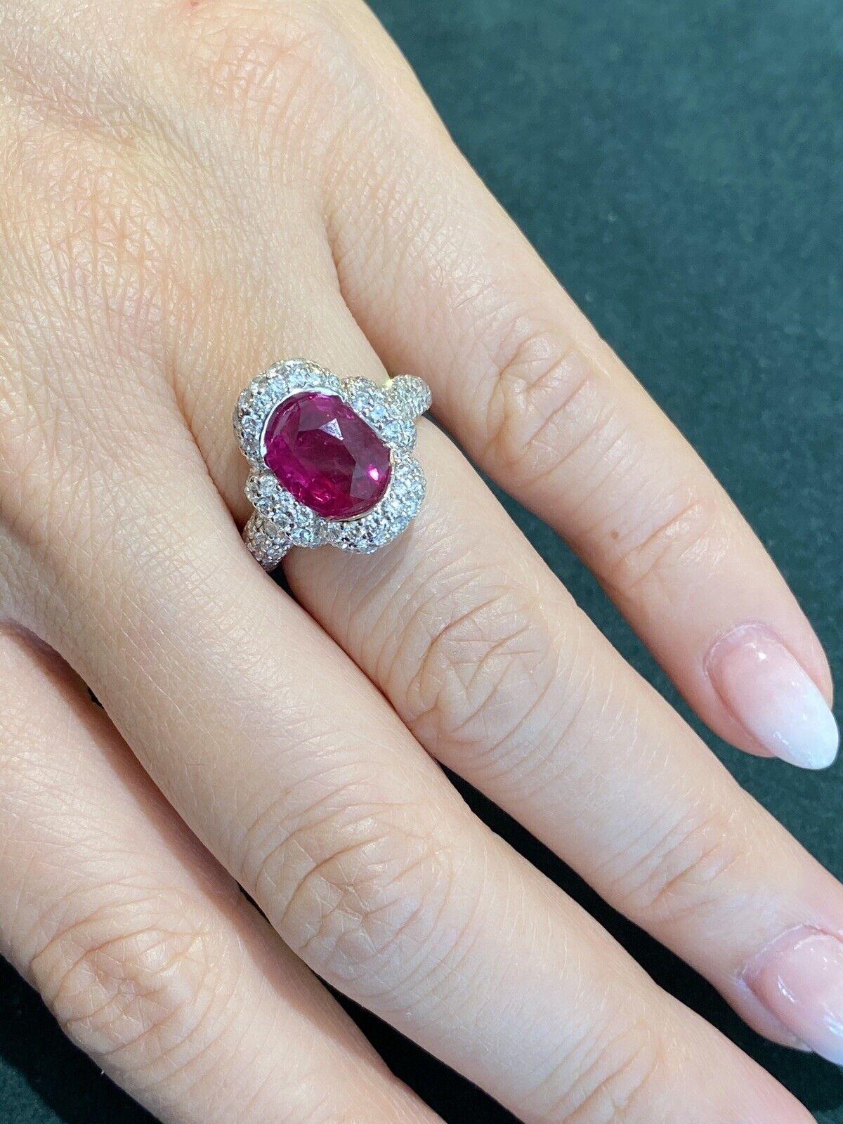 GIA Natural Oval Burma Ruby 3.40 Carat in Platinum Pave Diamond Setting

Ruby and Diamond Ring features a Natural Oval shaped Red Ruby surrounded by Round Brilliant Diamonds Pave set in Platinum. The natural ruby originates from Burma and has been