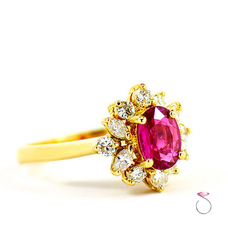 This gorgeous natural Ruby ring with diamond halo is a real show stopper. Featuring an approximately 1.20 carat vibrant red oval Ruby that scream with passion. The center ruby is set in four prongs surrounded by a diamond halo of 12 diamonds, 8