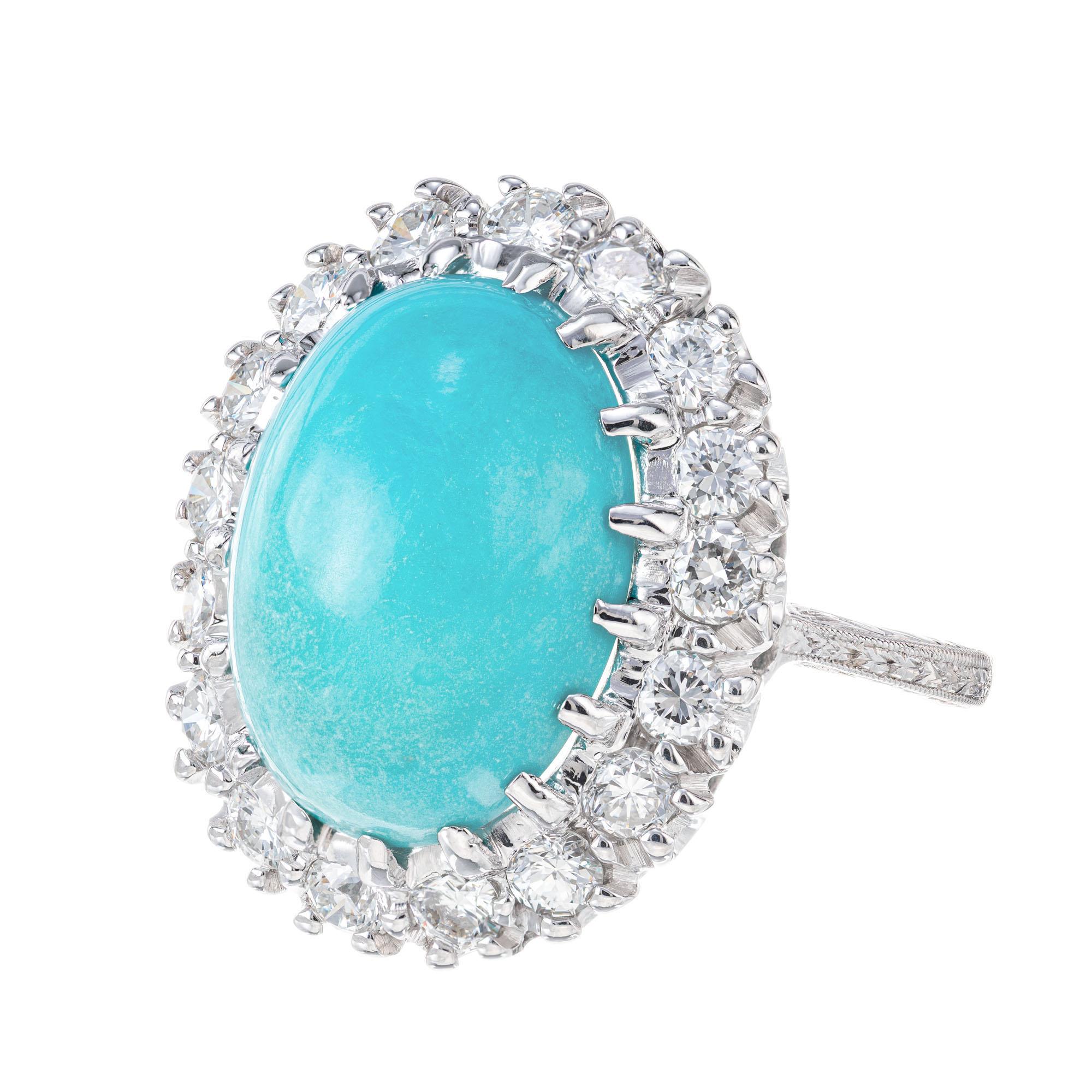 Mid-Century 1950's Persian Turquoise and diamond cocktail ring. GIA certified Oval center stone with a halo of 17 round full cut diamonds in a 14k white gold setting. 

1 oval natural blue to slightly yellow green Persian Turquoise, approx. total