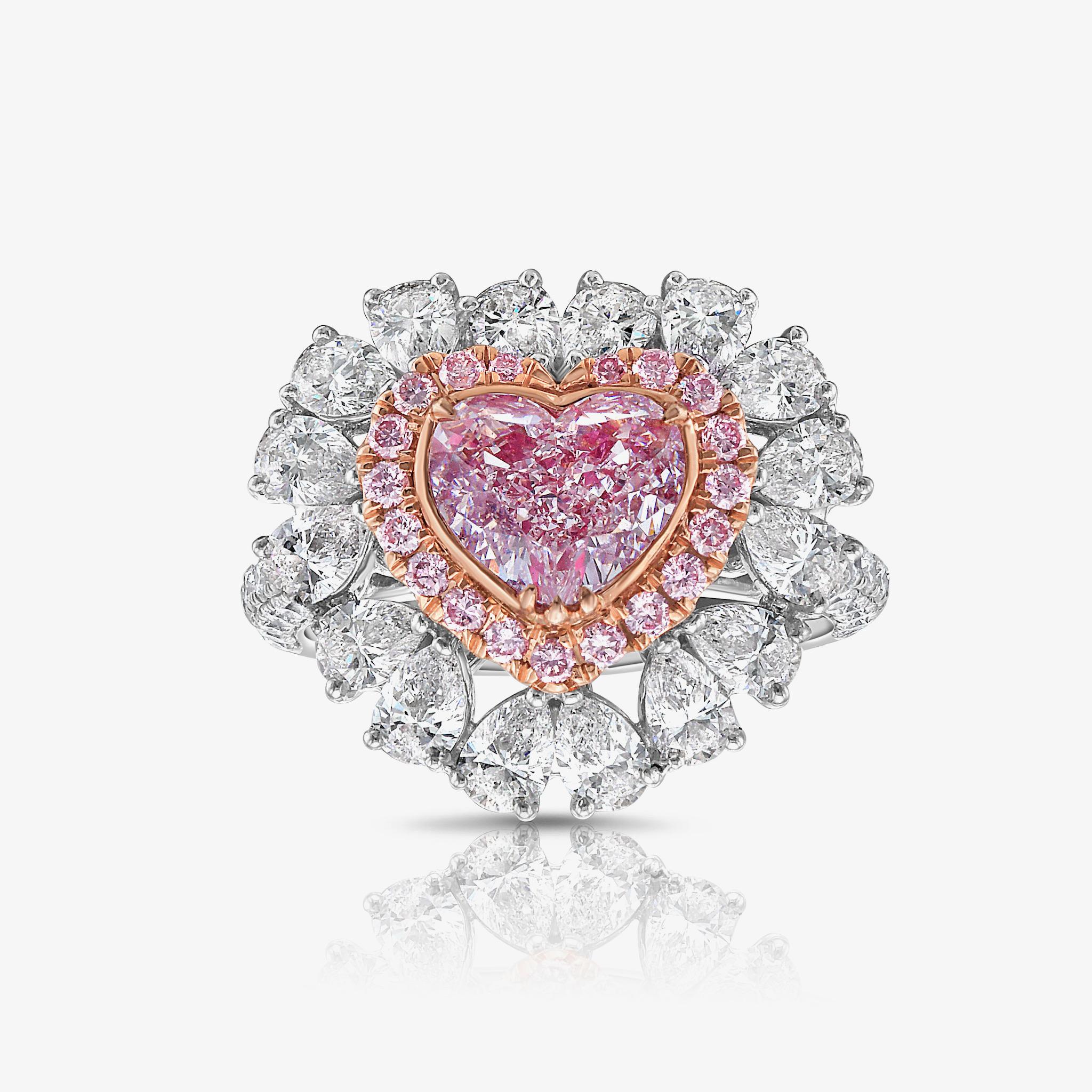 1.89 Carat Faint Pink Diamond
Heart Shape Diamond
SI1 Clarity 
Excellent, Very Good Cutting 
2.70 Carats of surrounding white diamonds 
0.22 Carats Surrounding Pink Rounds 
GIA Certified Pink Diamond
Crafted in 18k White Gold
Handmade in NYC

This