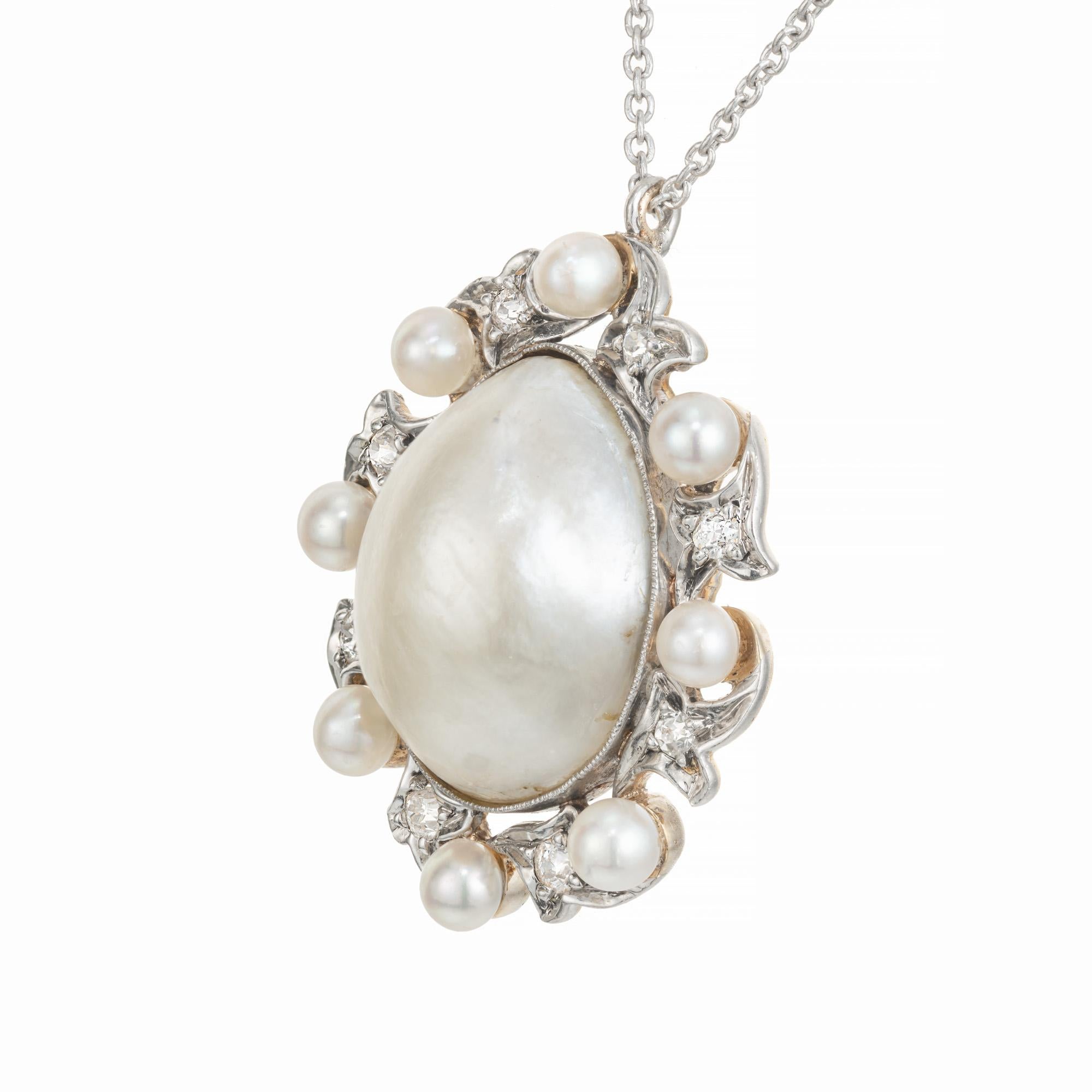 Edwardian 1900's Pearl and diamond pendant necklace. Saltwater center pearl with a halo of 8 round natural saltwater pearls mixed with 8 round old European cut diamonds., set in a platinum top with an 18k yellow gold back. GIA certified natural