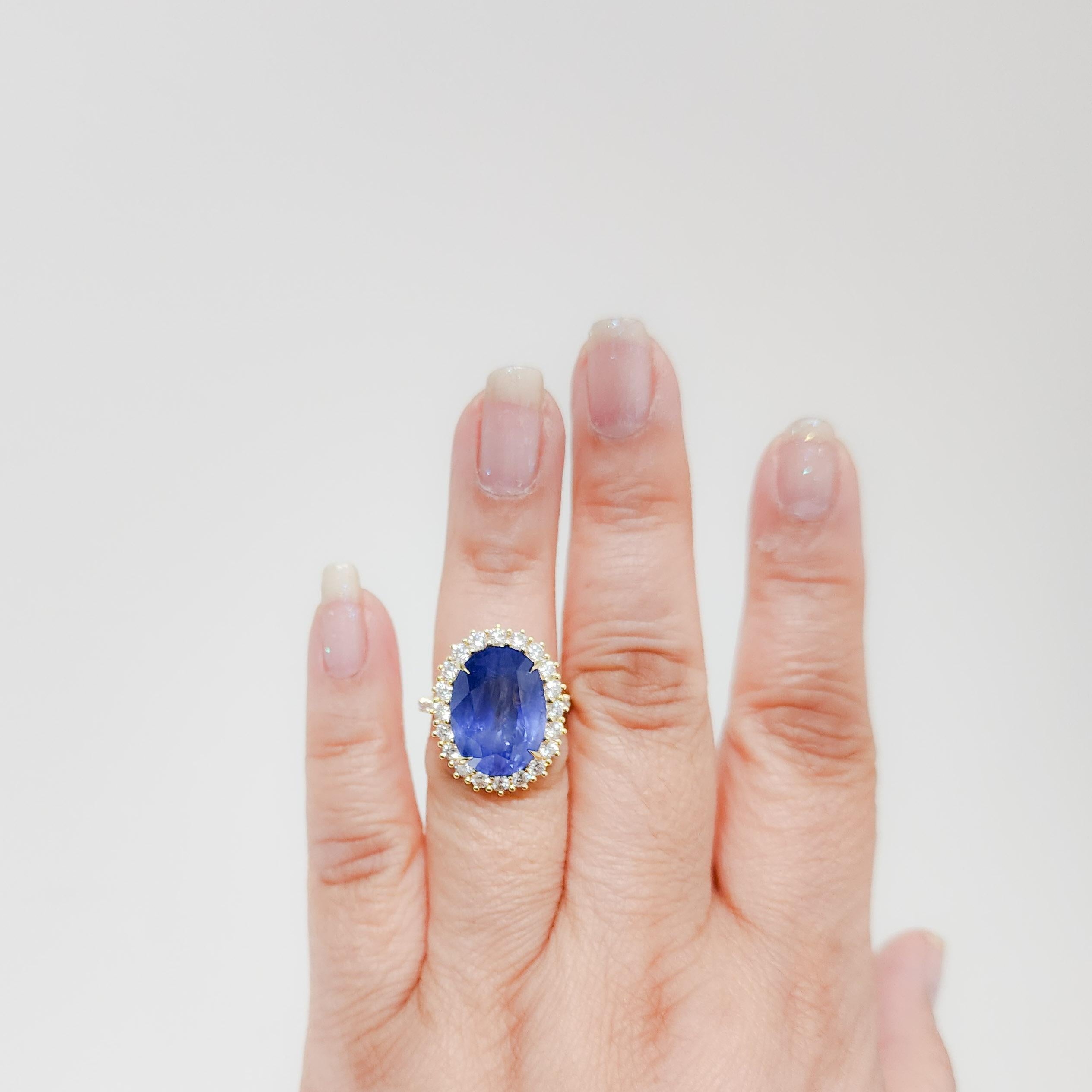 Gorgeous 17.23 ct. unheated Burma blue sapphire oval with 1.29 ct. of good quality, white, and bright diamond rounds.  Handmade in 18k yellow gold.  Ring size 6.5.  GIA certificate included.