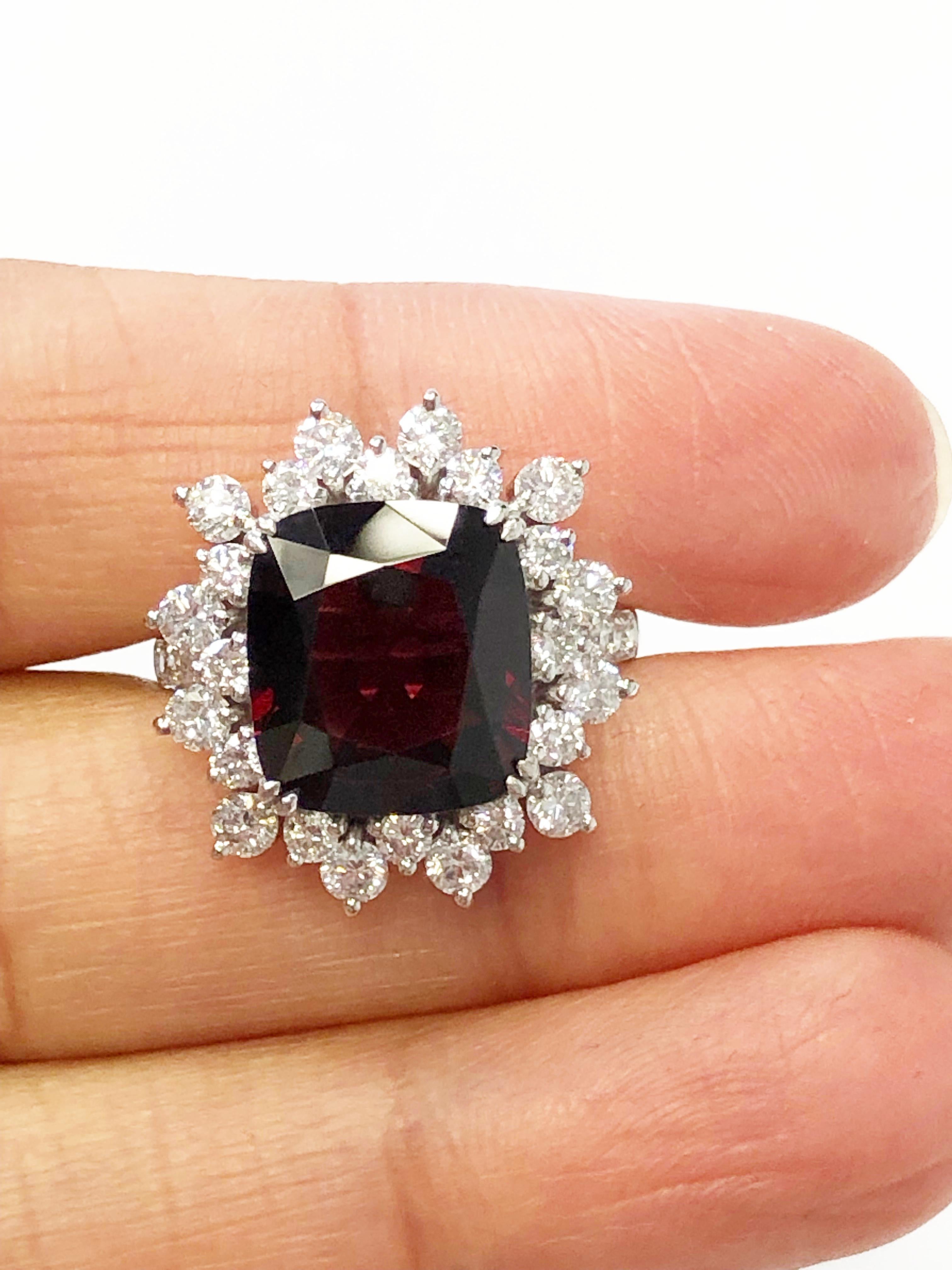 Captivating deep red no heat Burma red spinel cushion weighing 6.54 carats with 1.45 carats of bright white diamond rounds.  Handcrafted dainty platinum mounting in size 6.  GIA cert for red spinel available.


