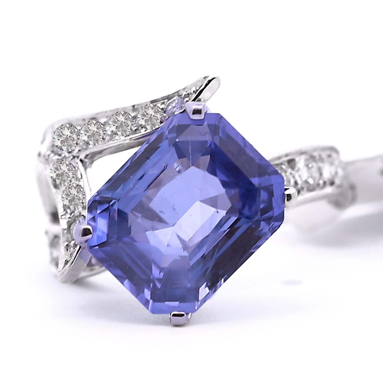 GIA-certified 6.19 ct. No Heat Color Change Sapphire Cocktail Ring. This extraordinary contemporary piece features a bright Violetish Blue sapphire that transcends to Purple. The white gold setting, adorned with diamonds, enhances the stone's